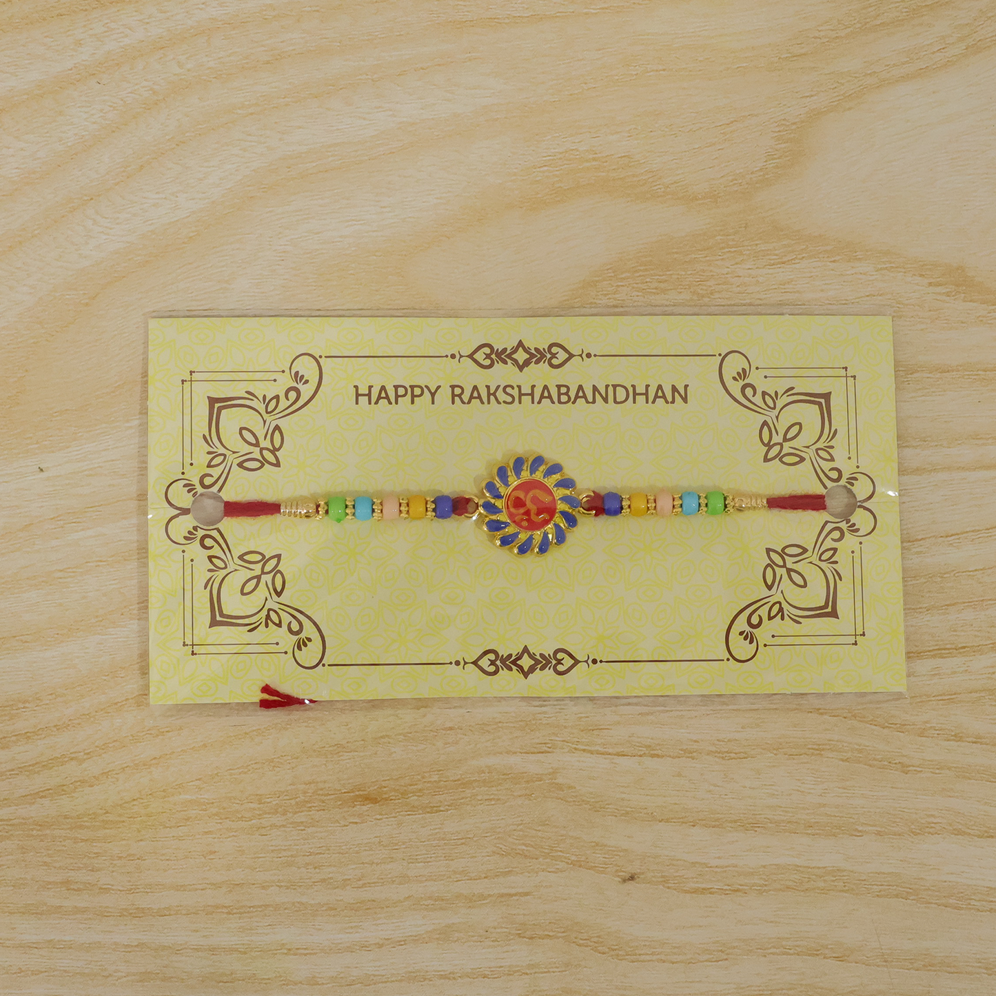 Wrist view of Raksha Bandhan OM Rakhi