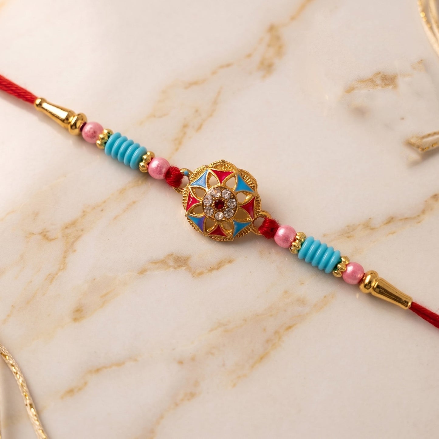Vibrant floral stone Rakhi with colorful beads