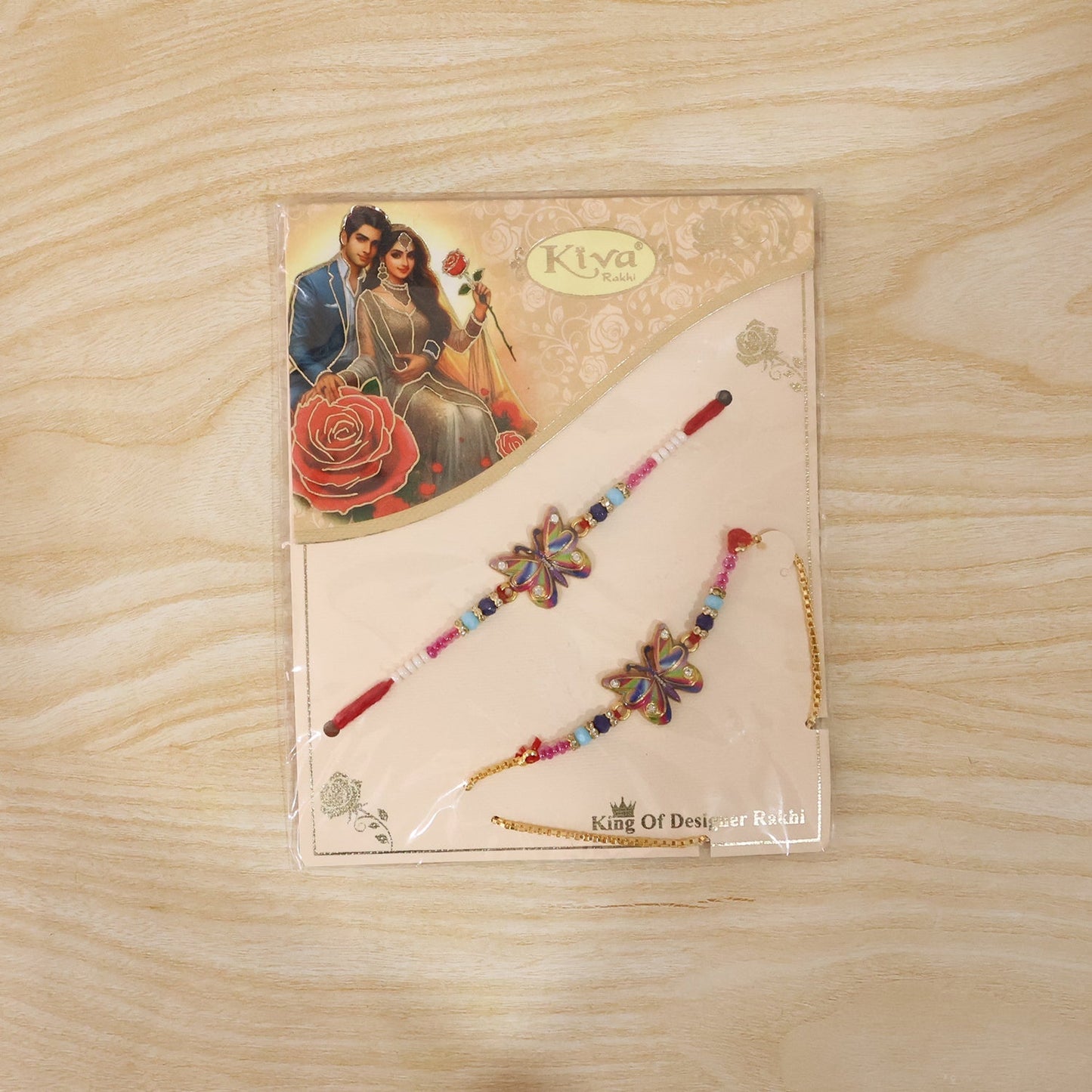 Rainbow Butterfly Rakhi on hand illustrating scale