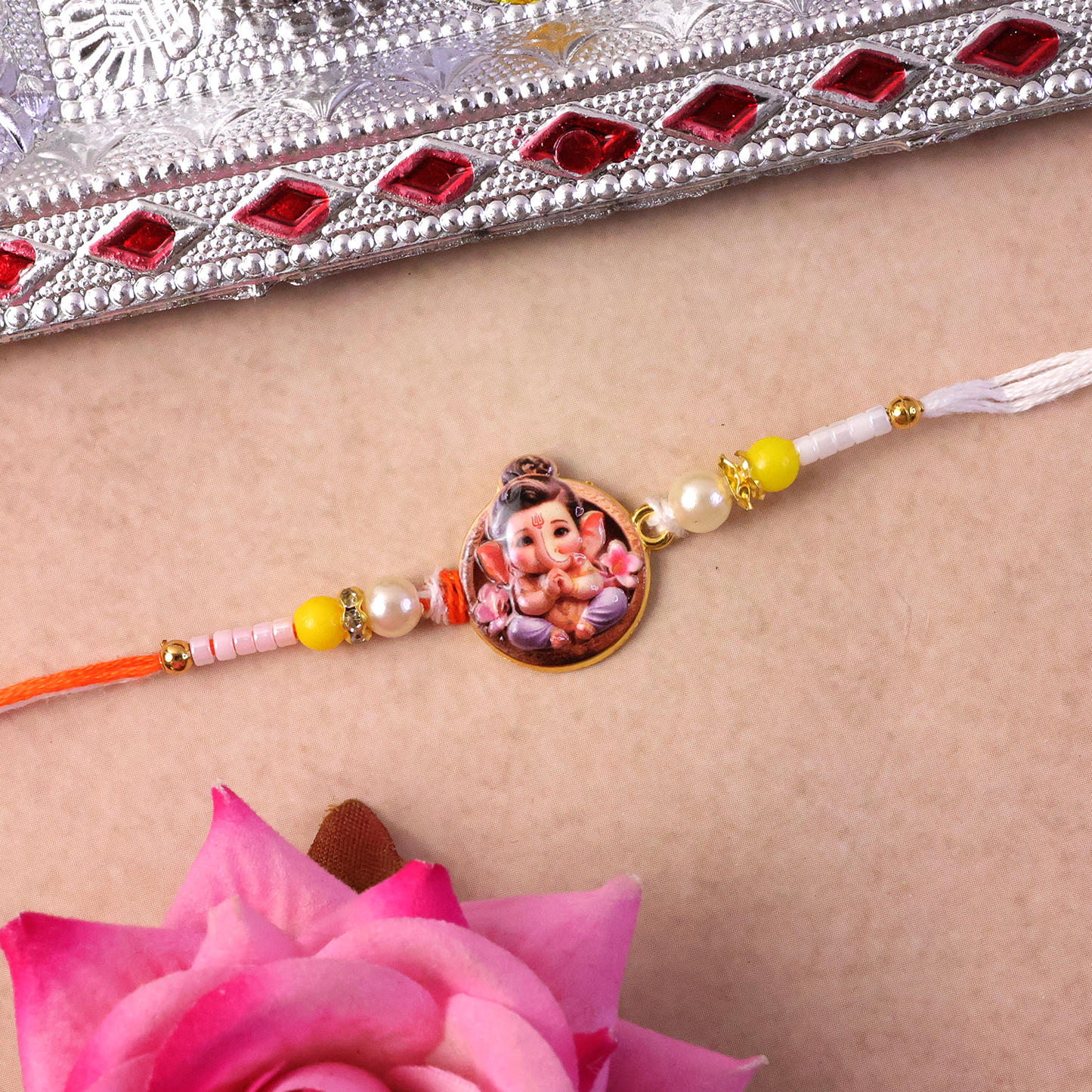 Vibrant beads and intricate design of Ganesh Ji Rakhi
