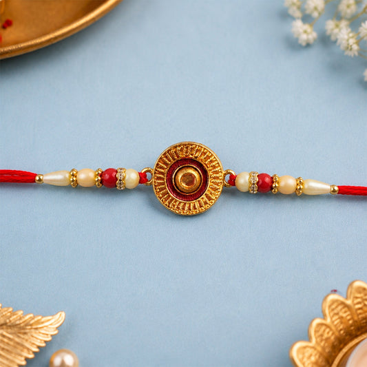 Traditional round rakhi adorned with pearl beads showcasing elegant festive design.