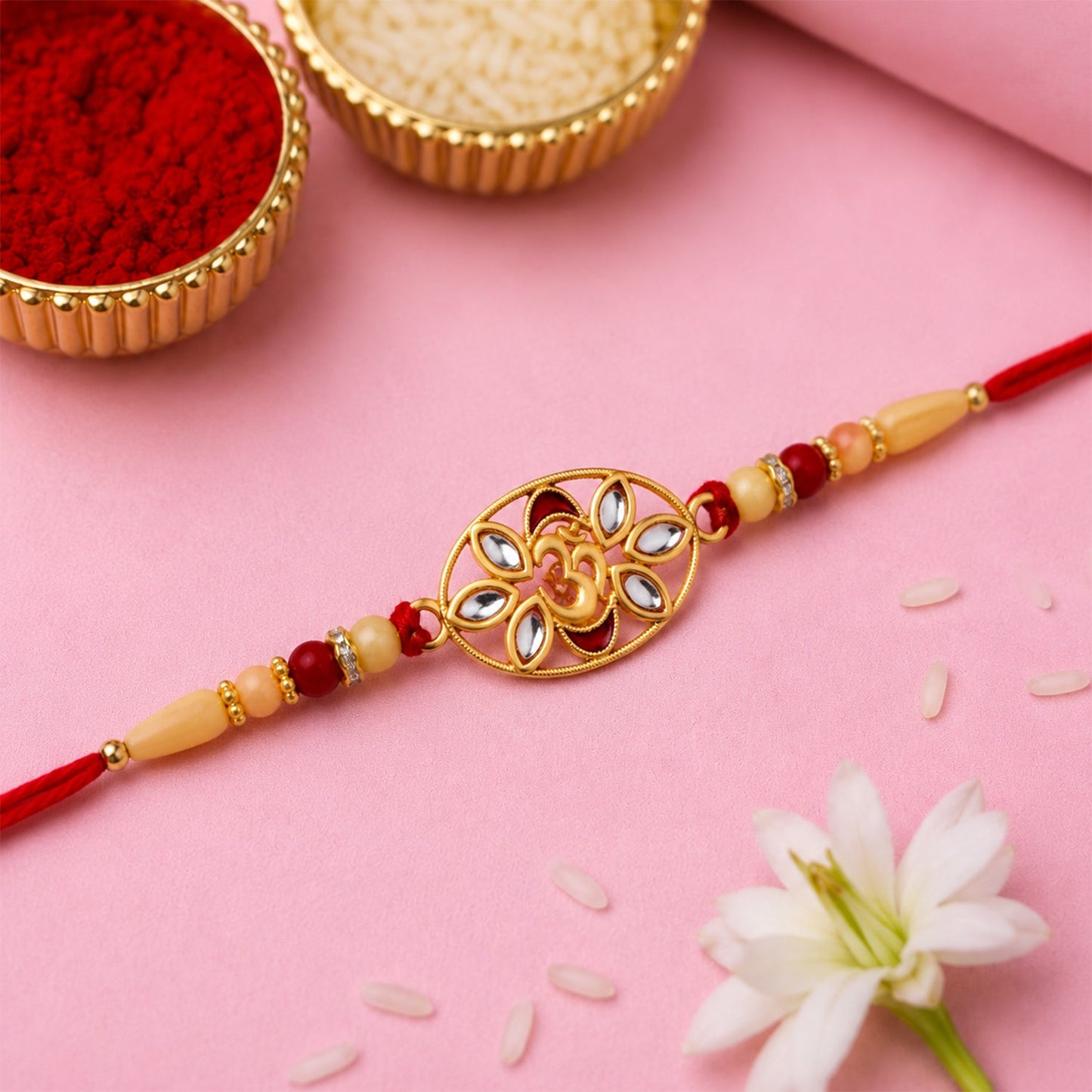 Close-up view of the Om Kundan Rakhi showcasing its intricate design and lustrous pearl detailing.