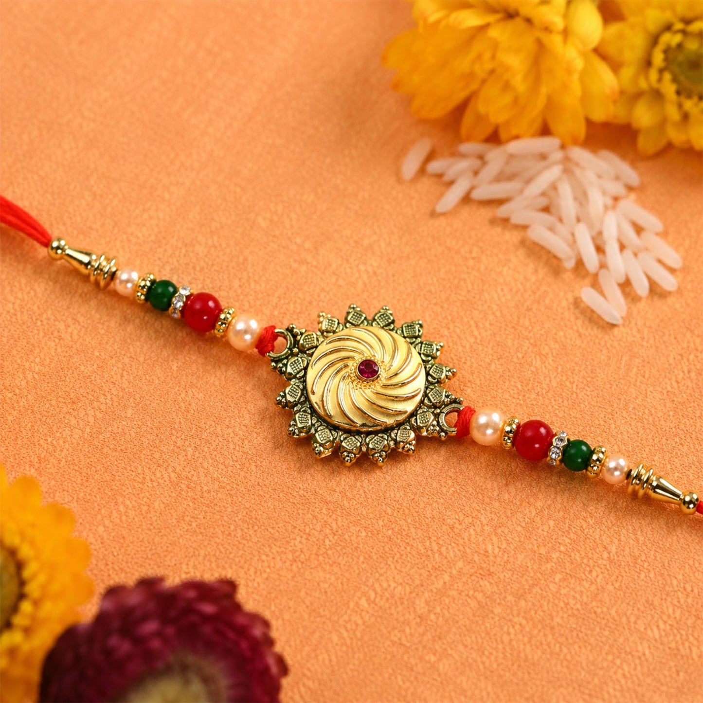 Traditional round shape rakhi with festive stone and bead embellishments