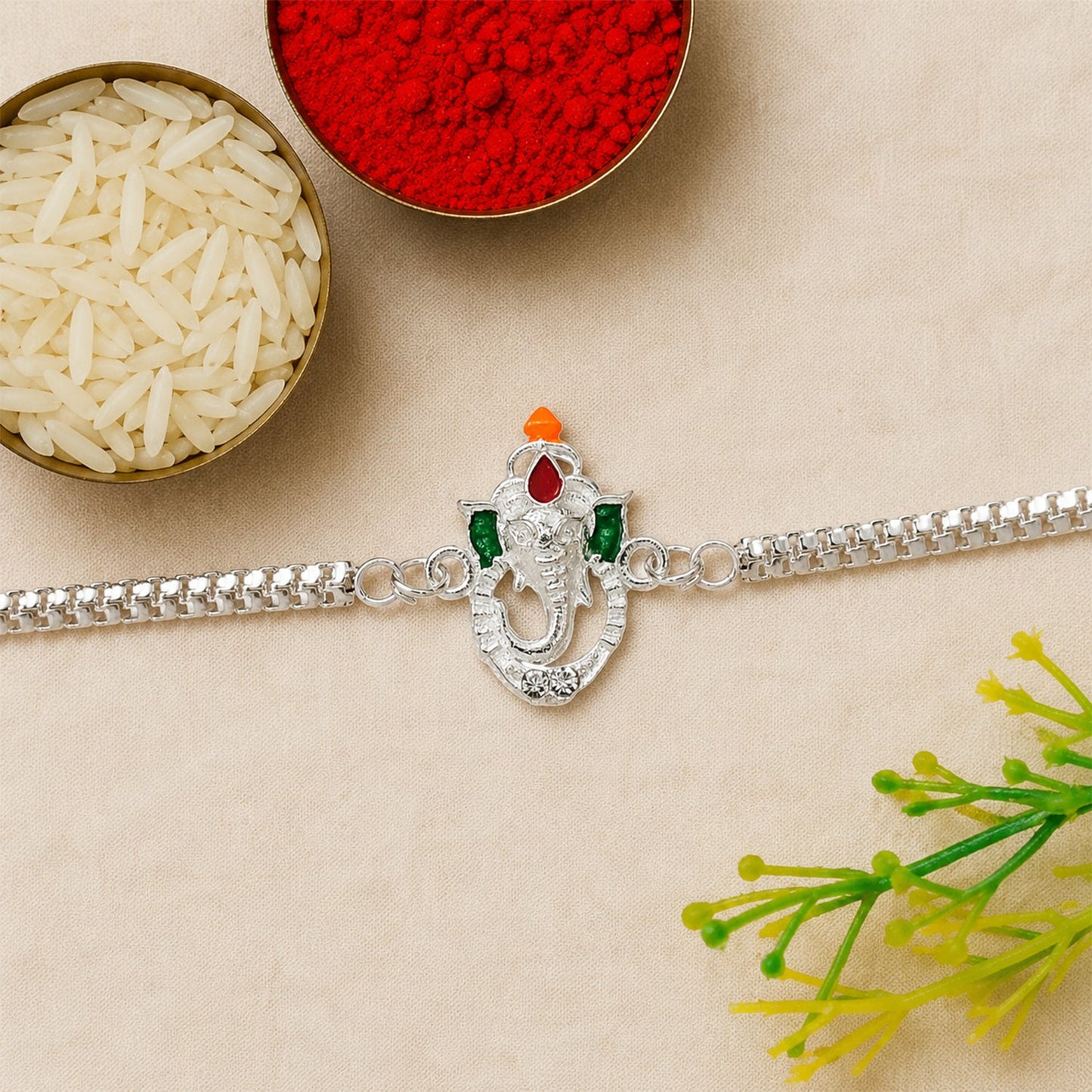 Side view of the stylish Ganesha Rakhi showcasing its modern design and comfortable fit.