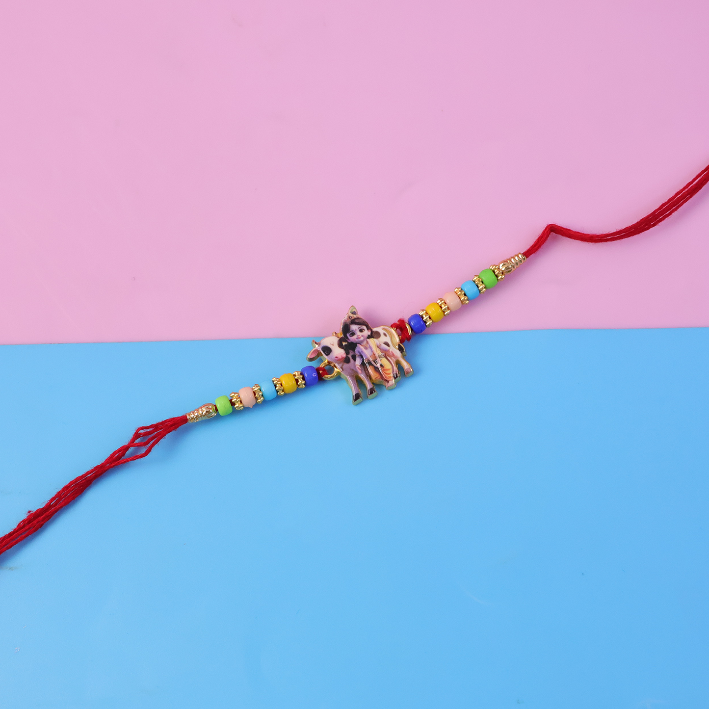 Side angle view of the Lord Krishna Rakhi, highlighting its decorative elements.