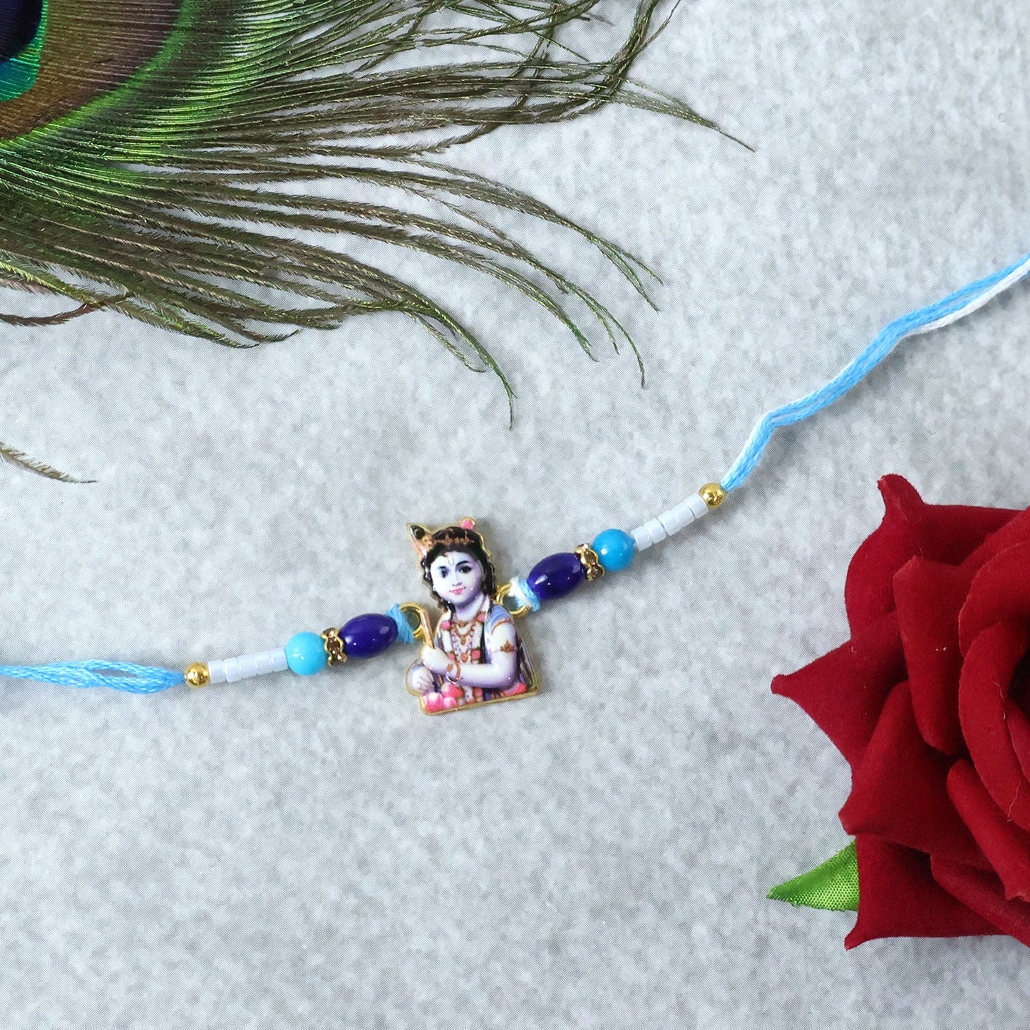 Top view of Blue Beads Rakhi with intricate design