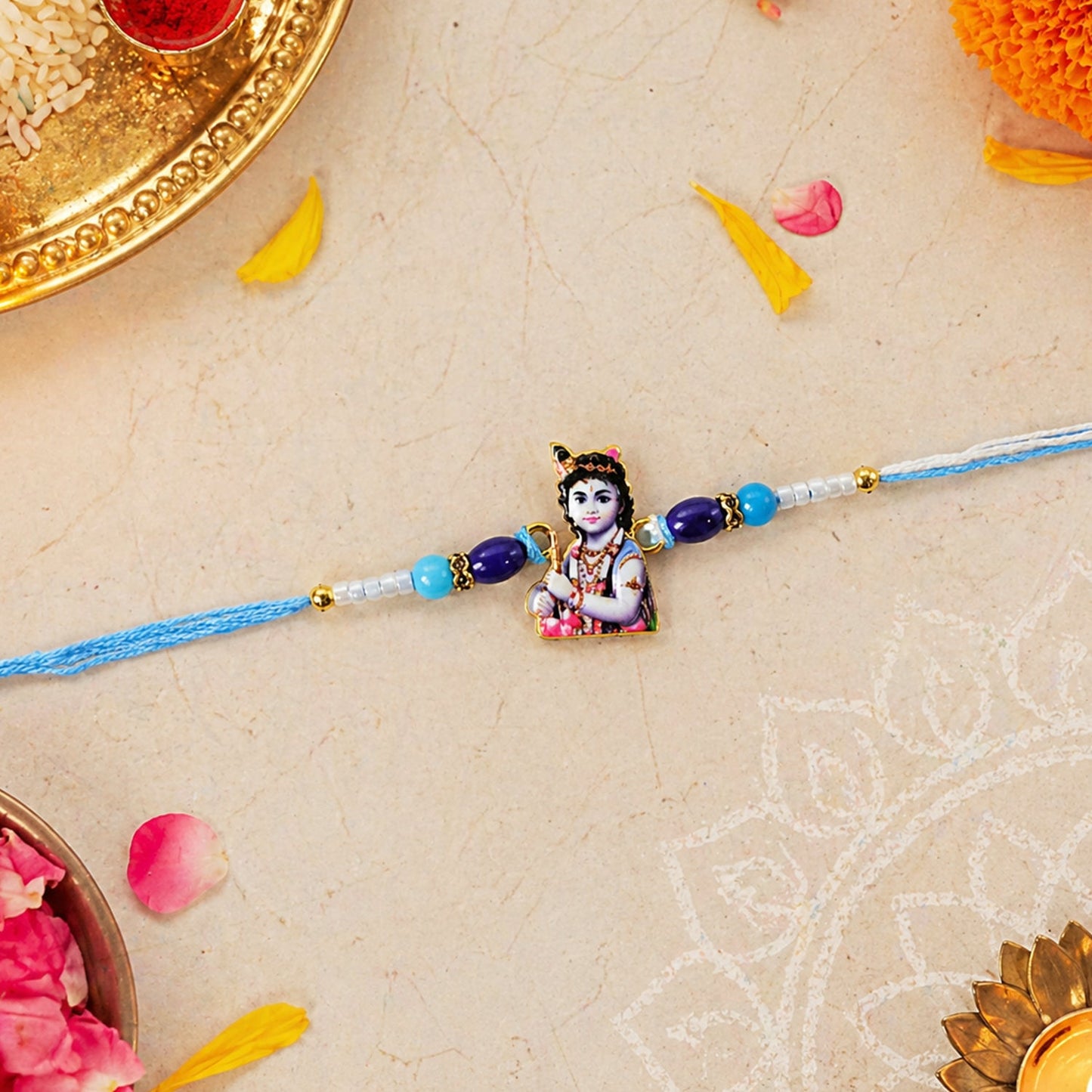 Close-up of Lord Krishna Rakhi featuring intricate design