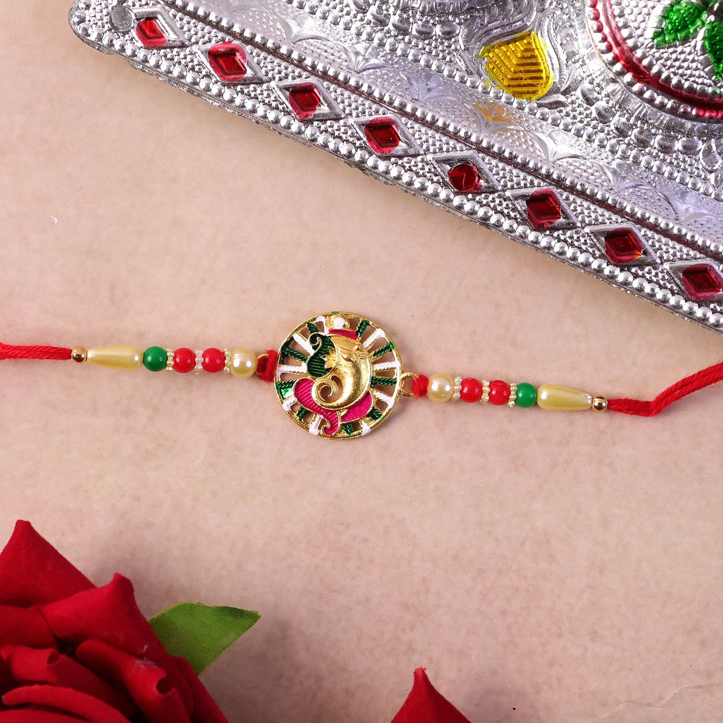 Side view of Ganesha Rakhi, highlighting design detail
