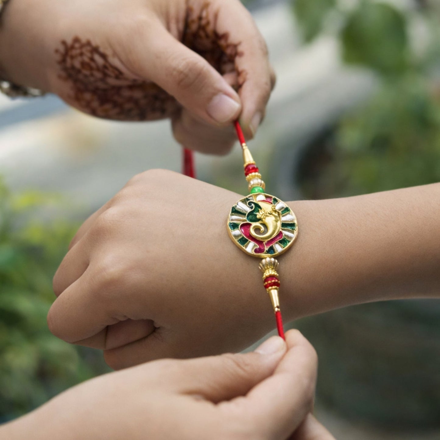 Soft thread with bead decoration on Ganesha Rakhi