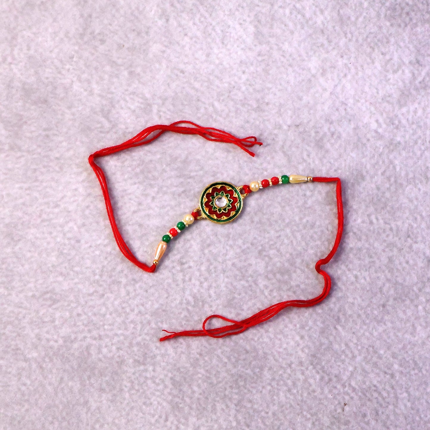 Floral Rakhi with stone and colorful beads close-up
