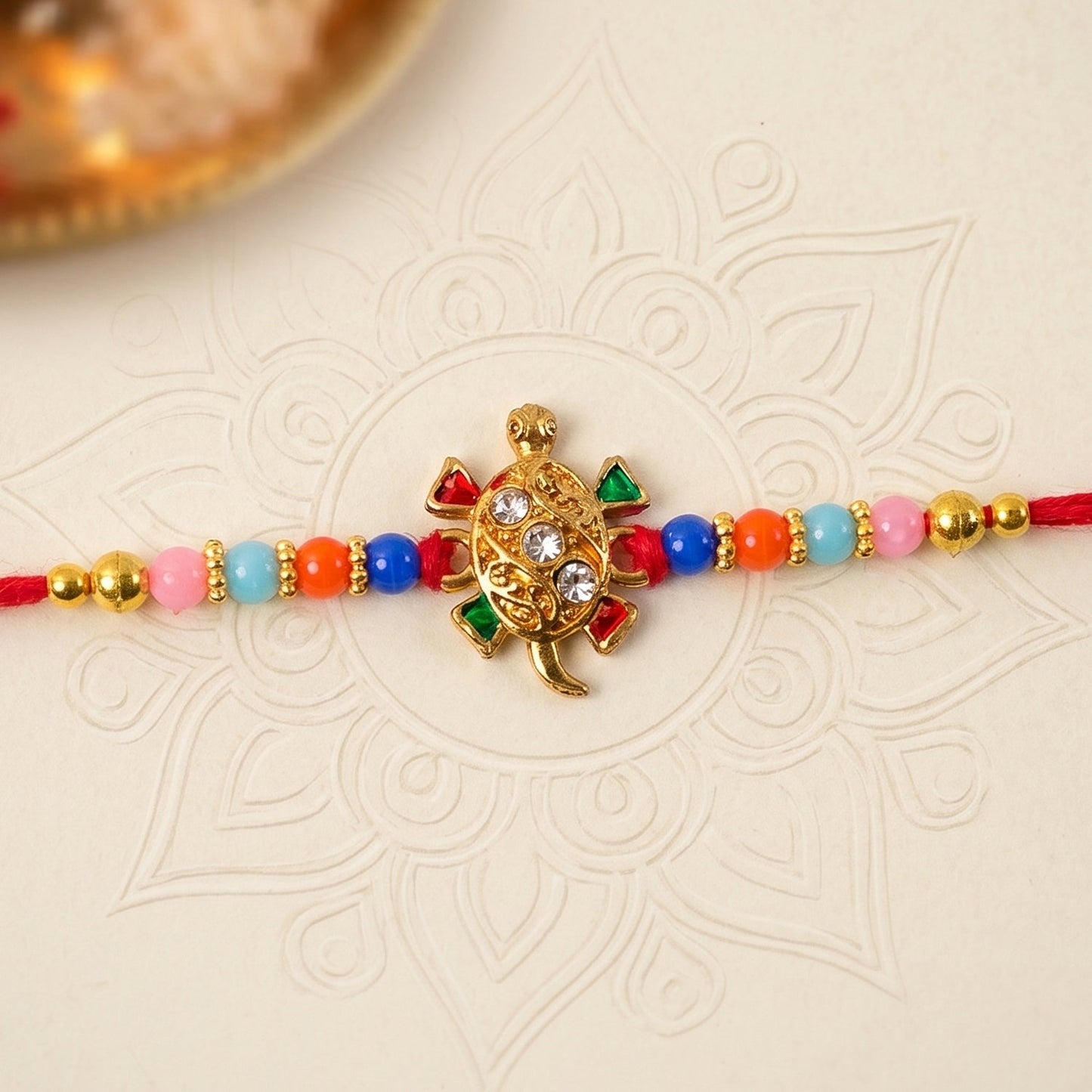 Side view showing bead details of turtle Rakhi