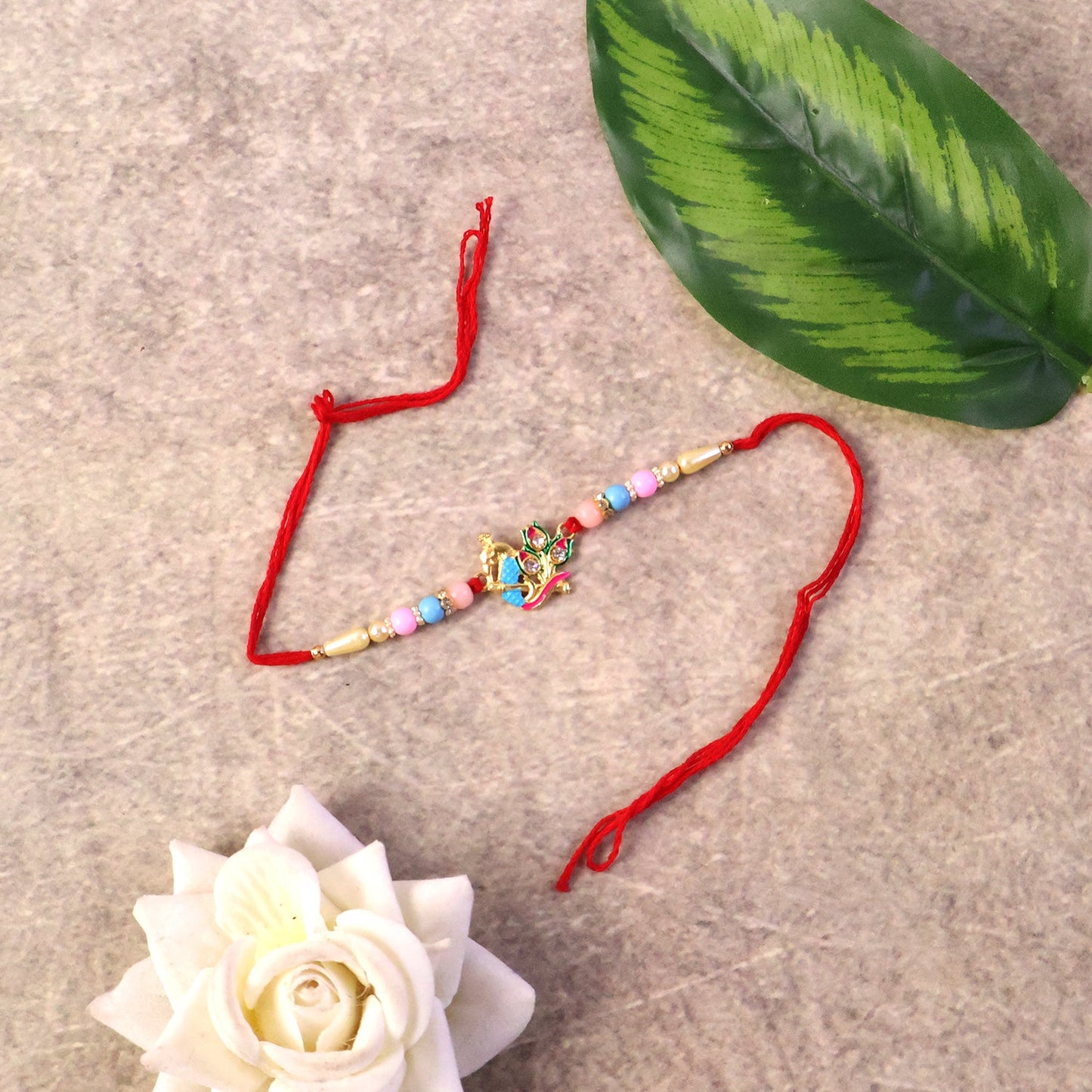 Traditional peacock design Rakhi with festive colors and beads
