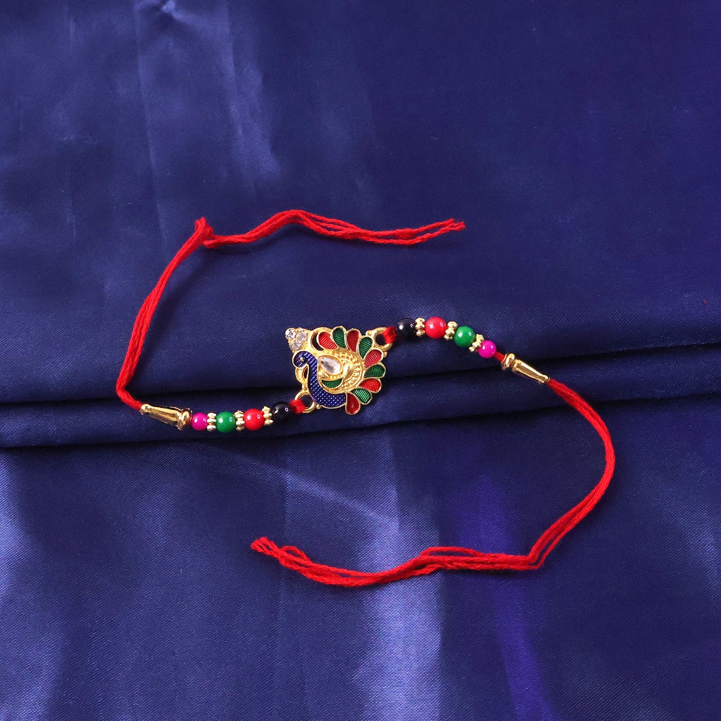 Festive peacock rakhi with skin-friendly thread