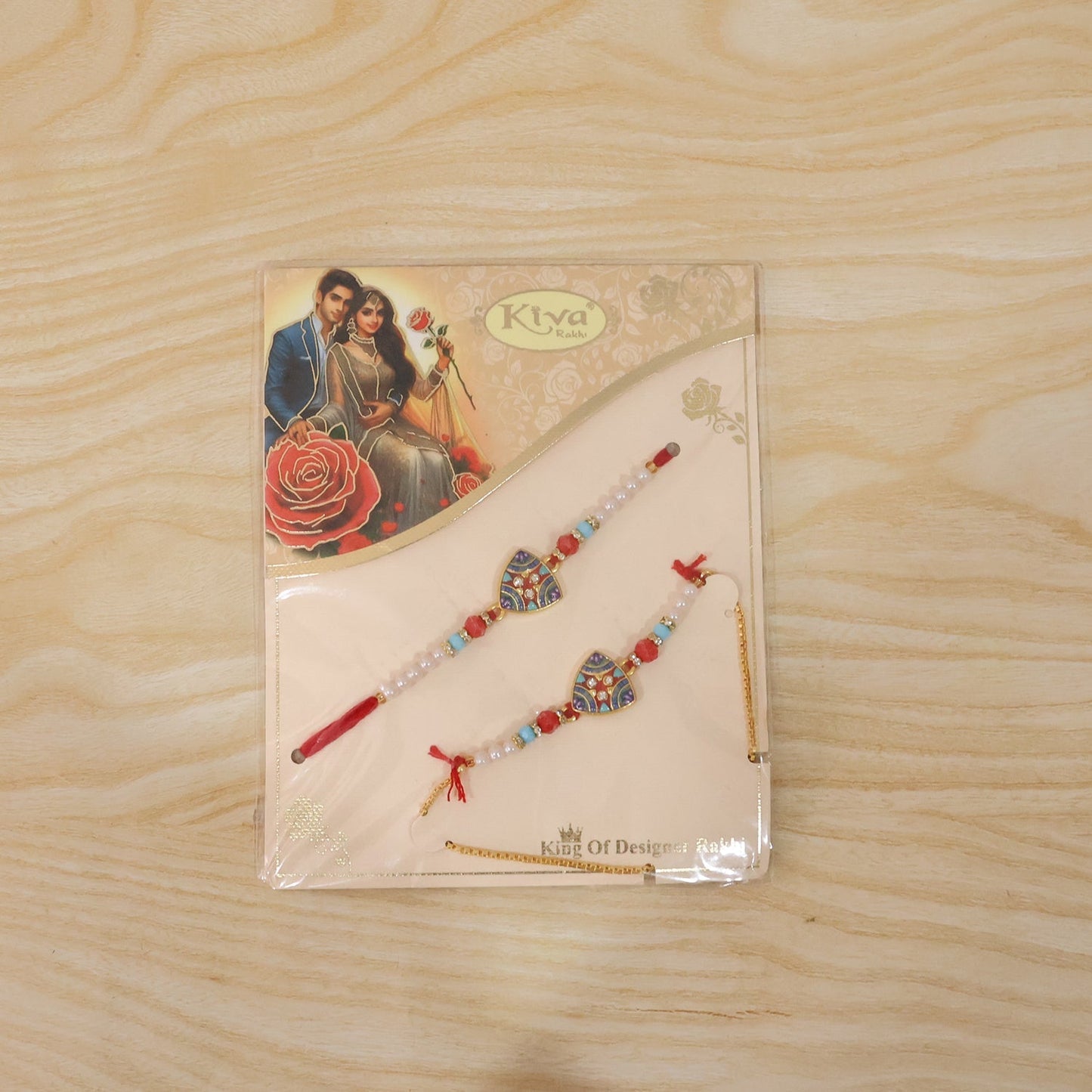 Rakhi worn on wrist showing detailed design