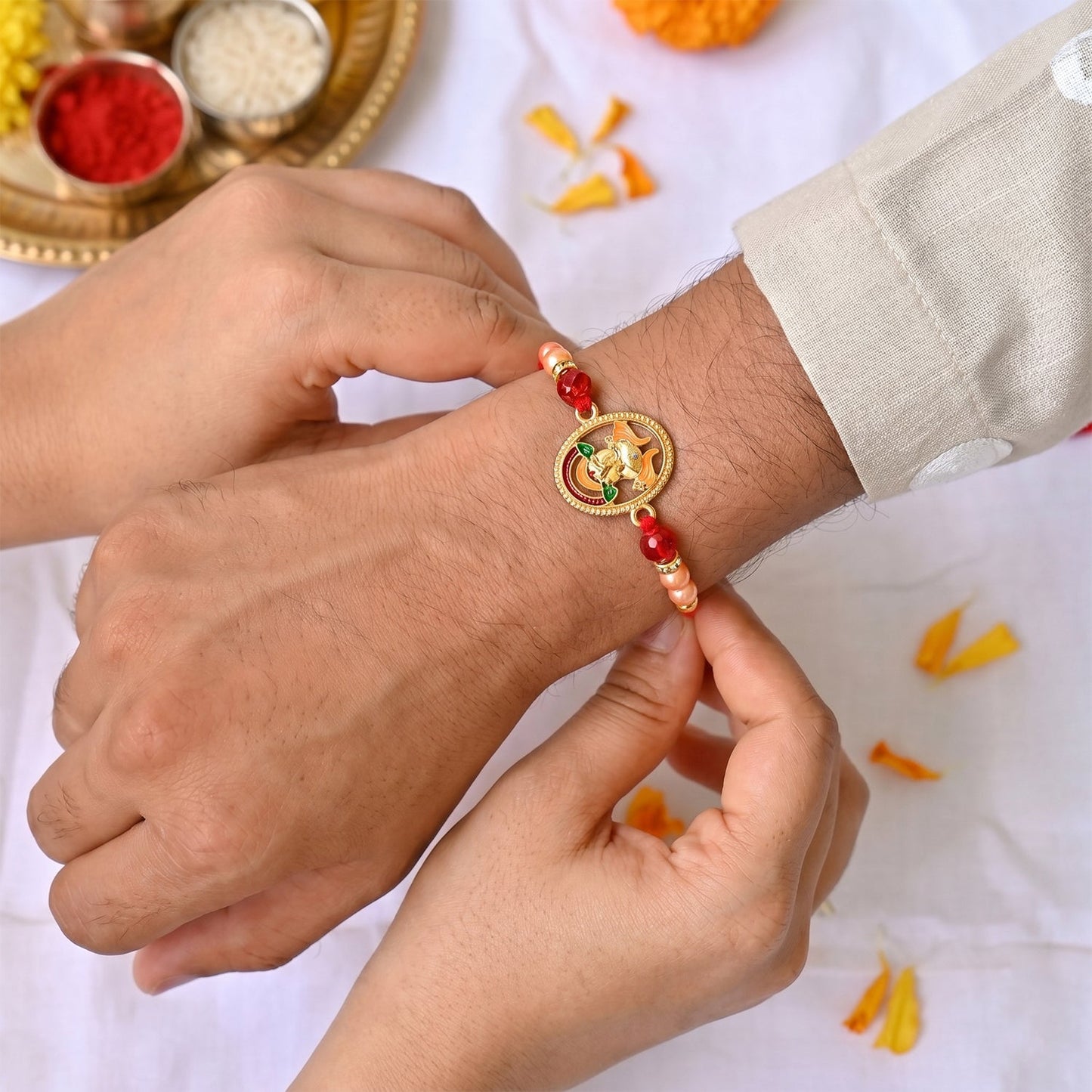 Decorative beads on traditional Ganesha rakhi