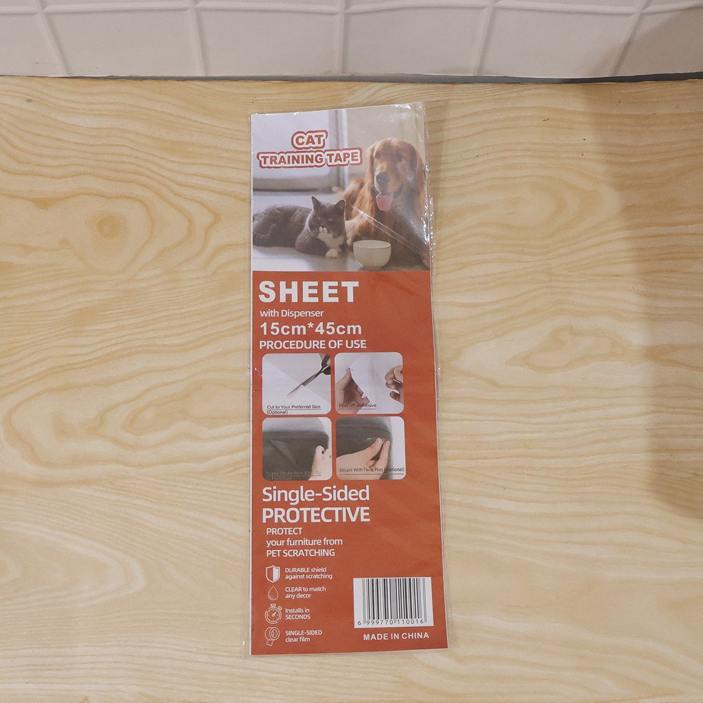 Pet owner applying transparent scratch prevention tape on furniture