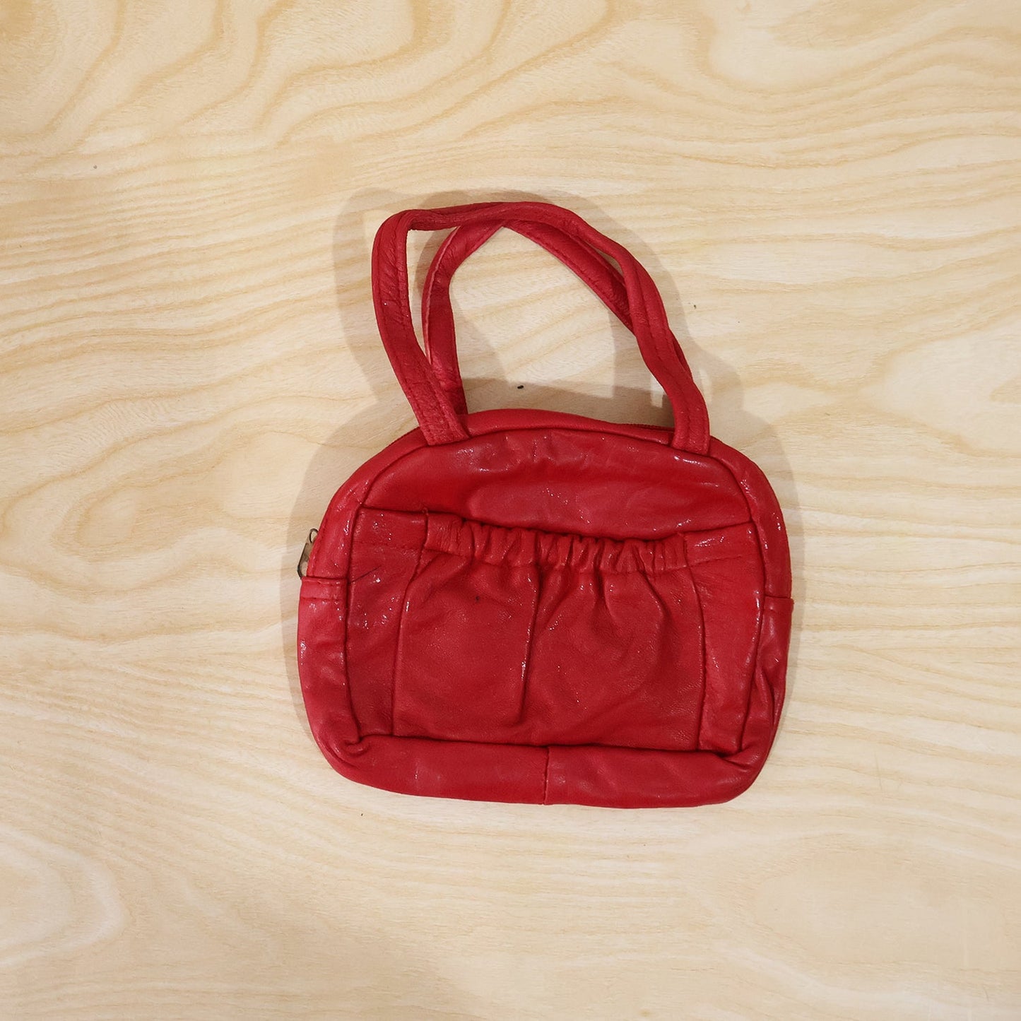 Red mini handbag with secure zipper and front pocket for girls