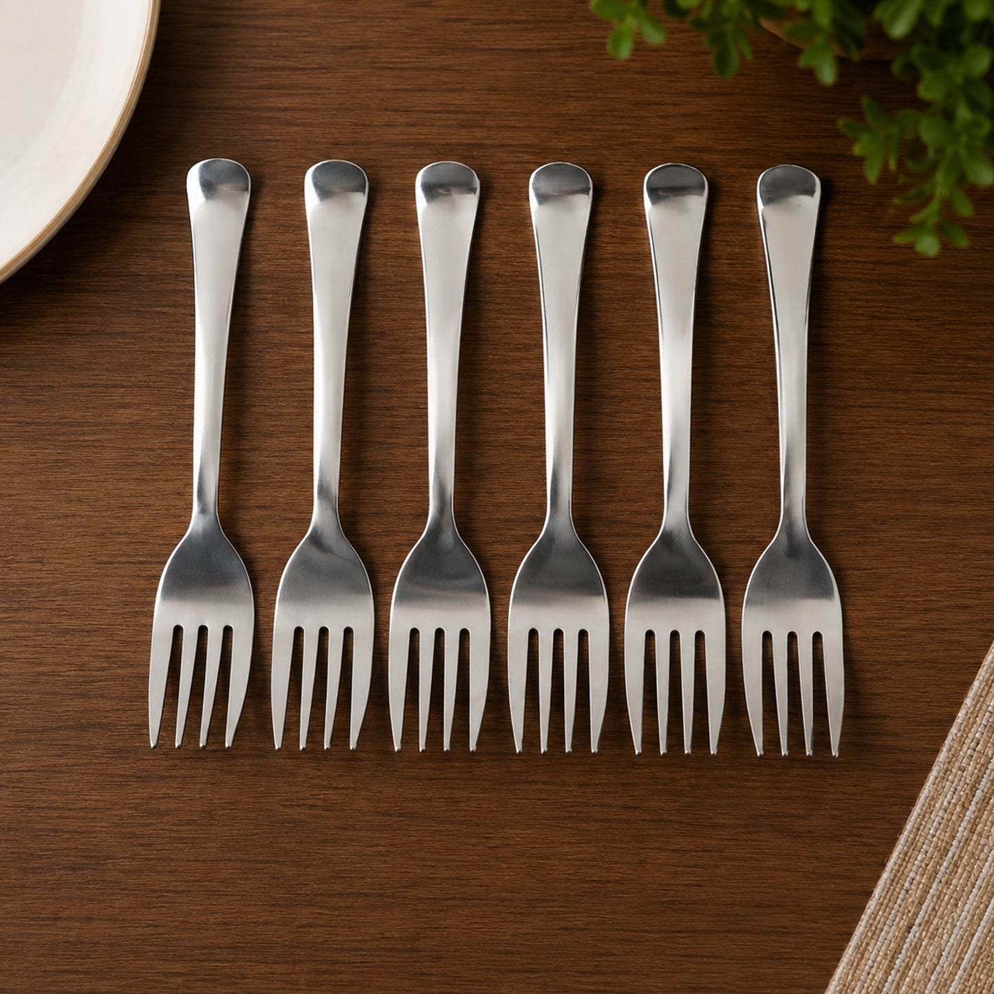 Dinner forks laid at a table setting