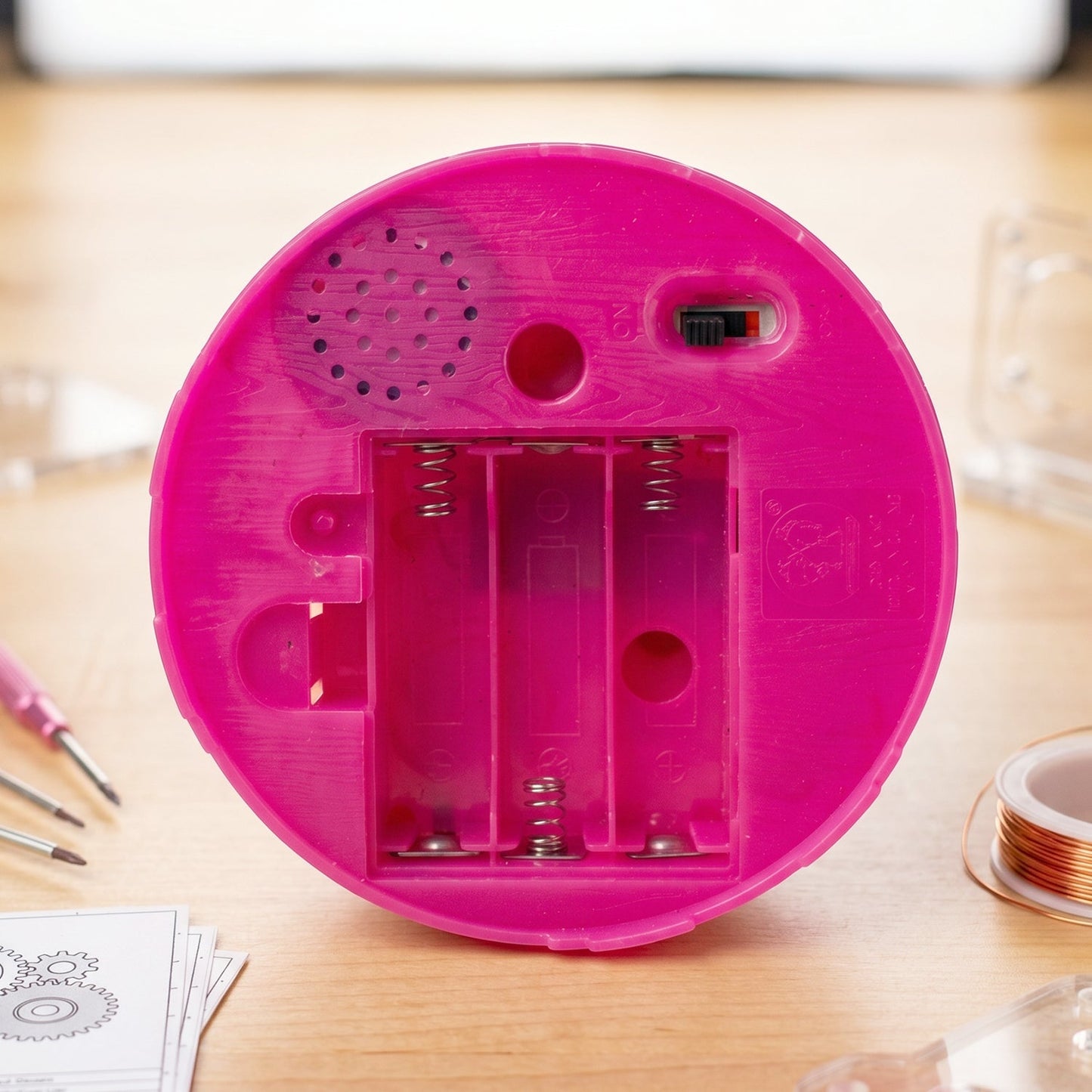 Colorful and fun kids toy with sound effects and interactive features in a cage.