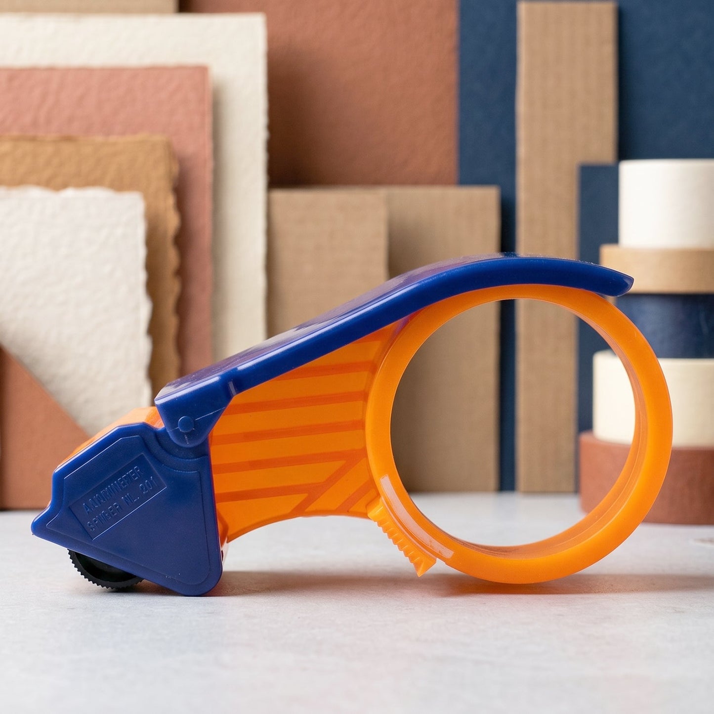 Tape dispenser ideal for parcel and courier packing