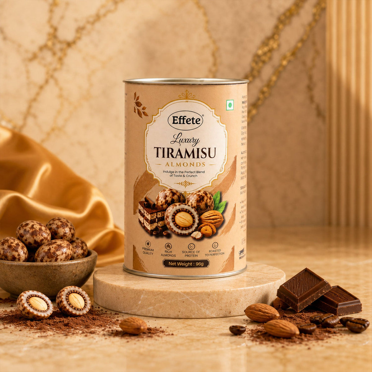 The Effete Luxury Tiramisu Almonds canister stands on a stone riser, surrounded by chocolate, almonds, and cocoa dust.