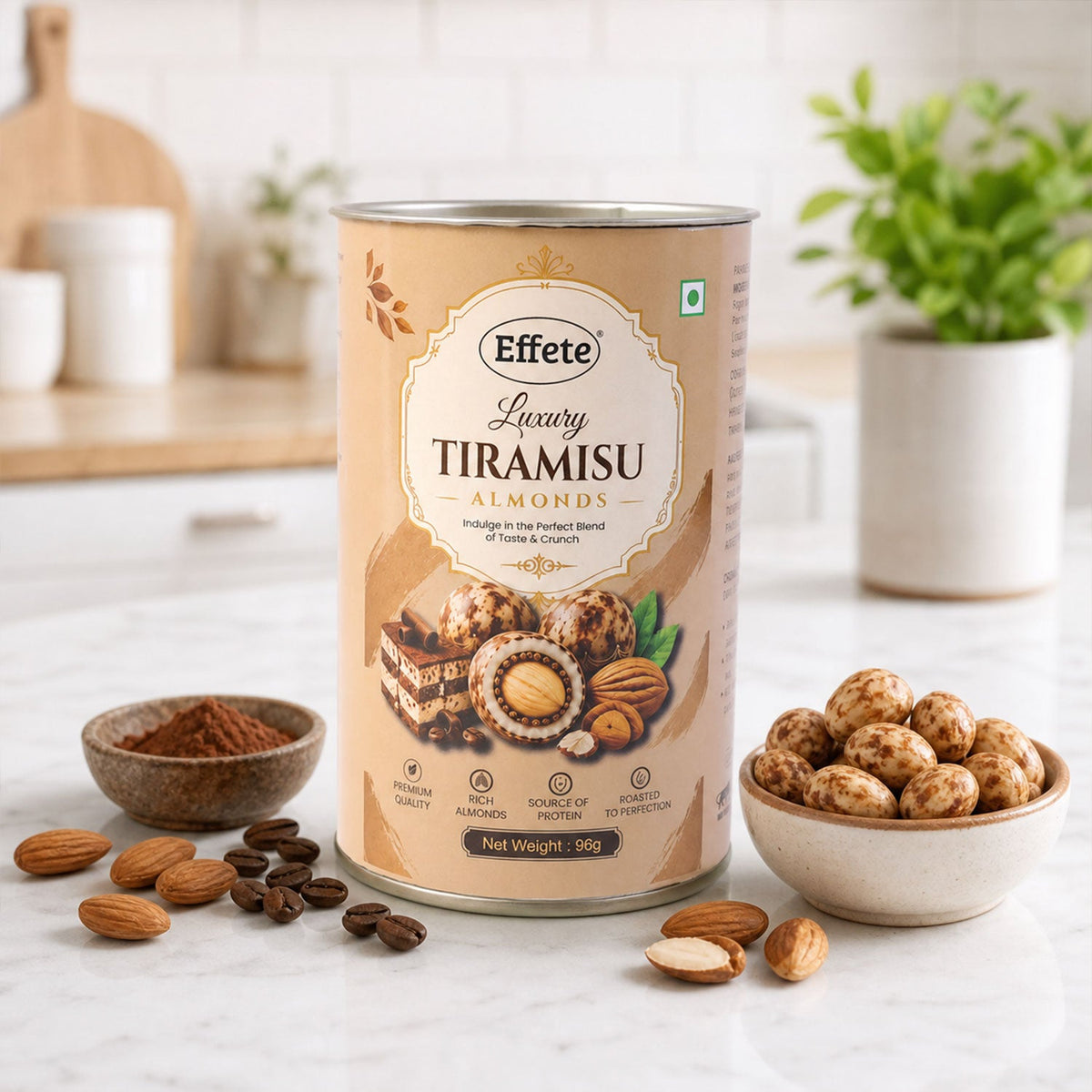The Effete Luxury Tiramisu Almonds canister is surrounded by a bowl of cocoa powder, whole almonds, and coffee beans.