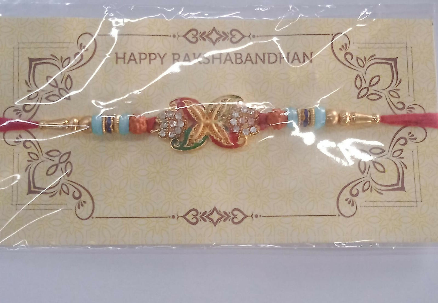 Detailed look at elegant bead Rakhi featuring golden flower motif and festive beads