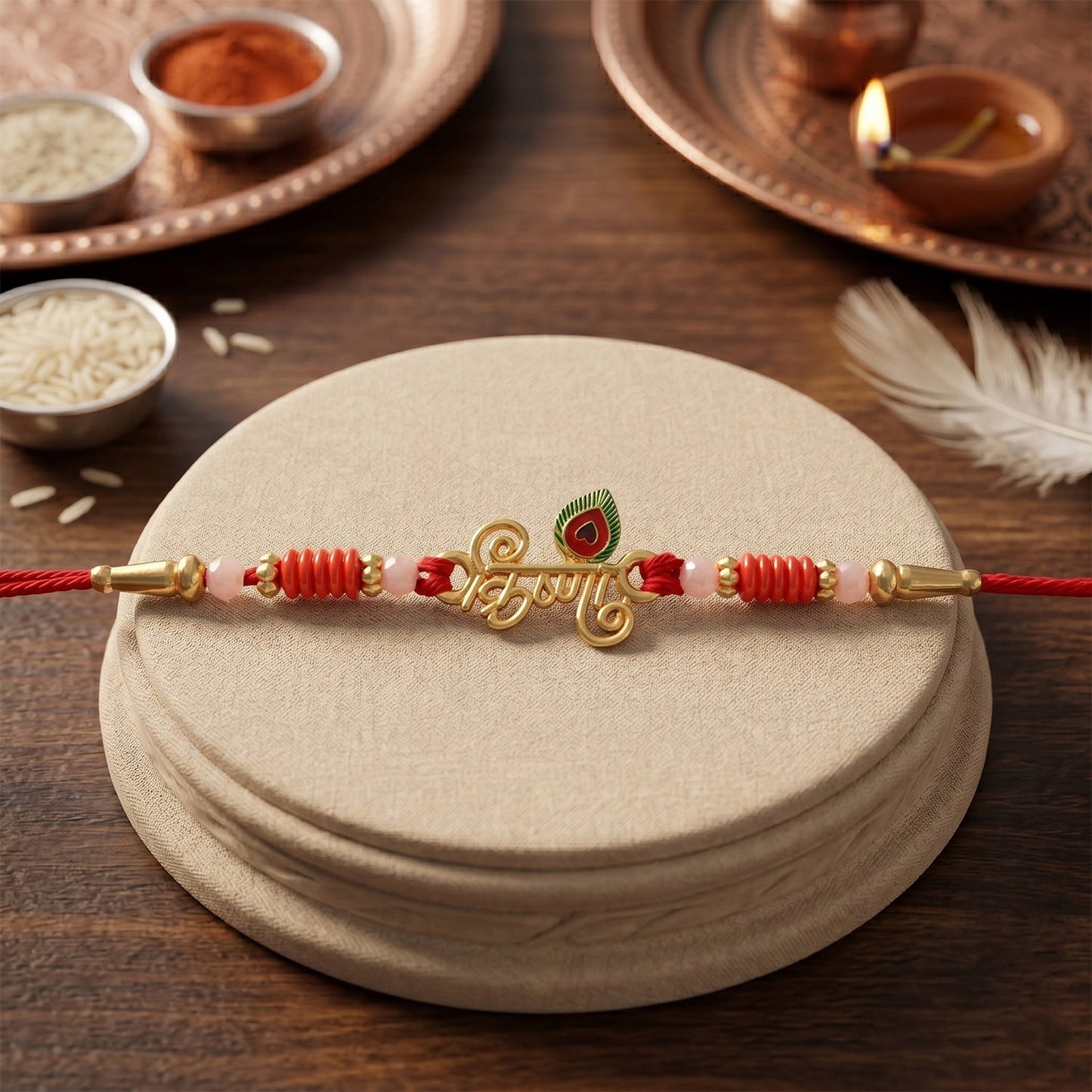 Close-up of Krishna Naam Devnagari Rakhi with beads and peacock feather