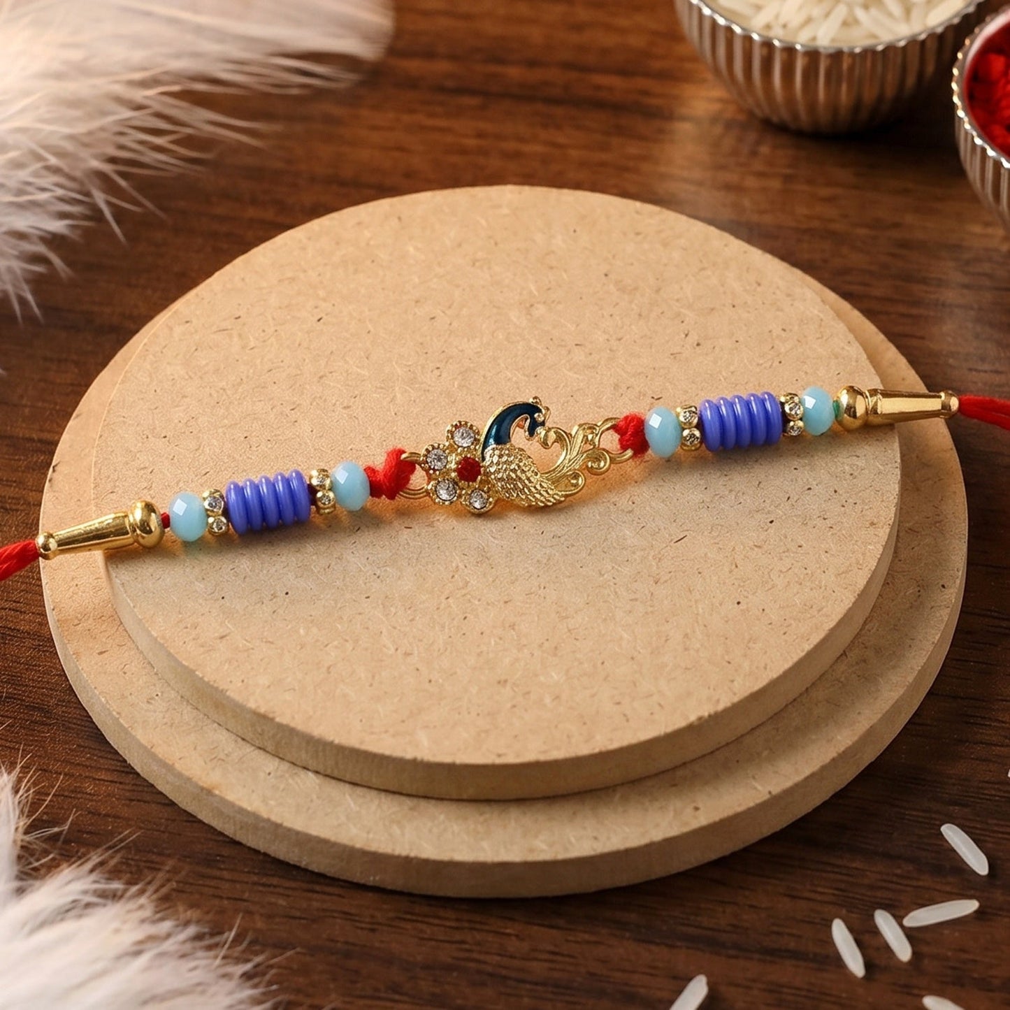 Side angle of antique peacock Rakhi showcasing detailed design