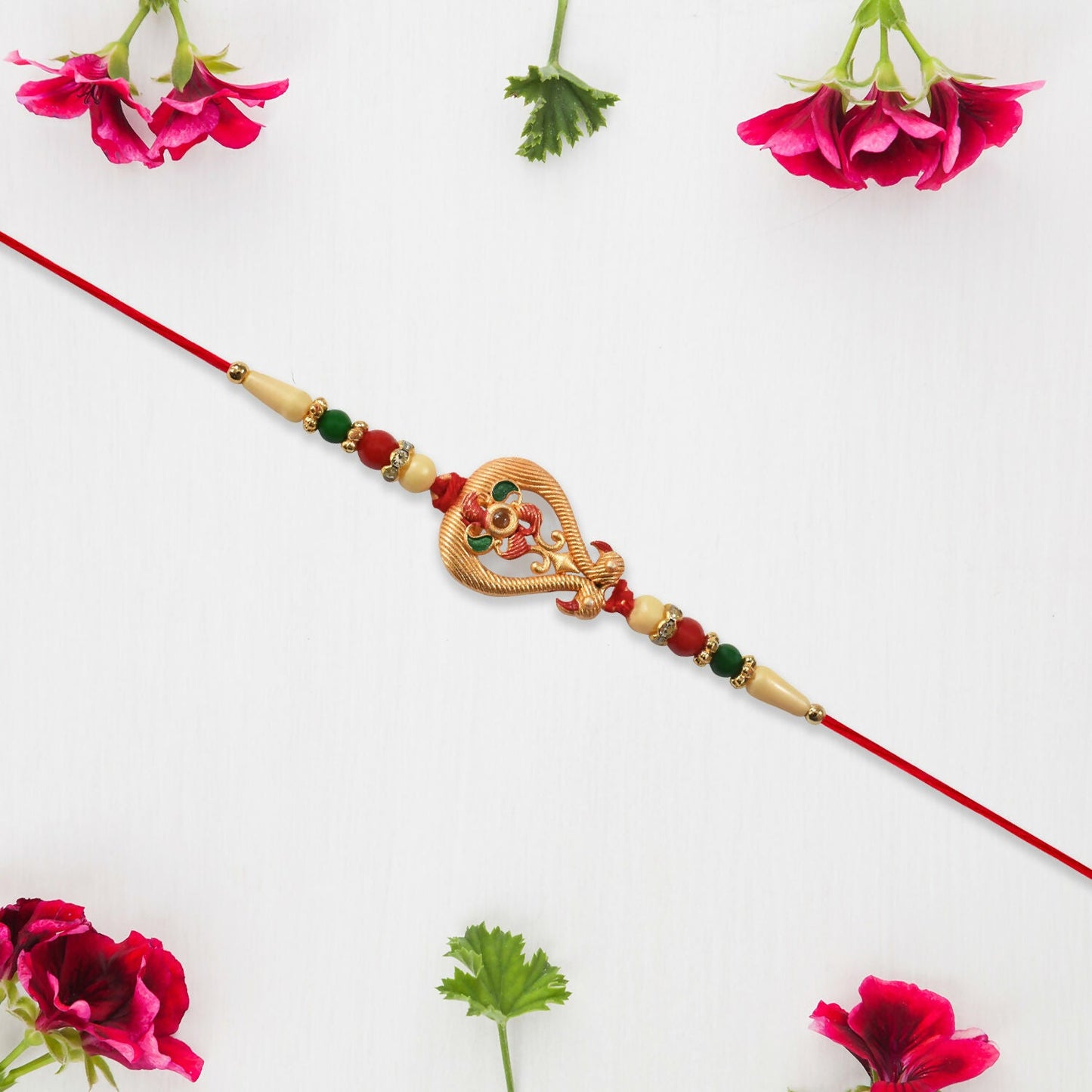 Top view of festive designer Rakhi for brother showing full beaded and threaded design.