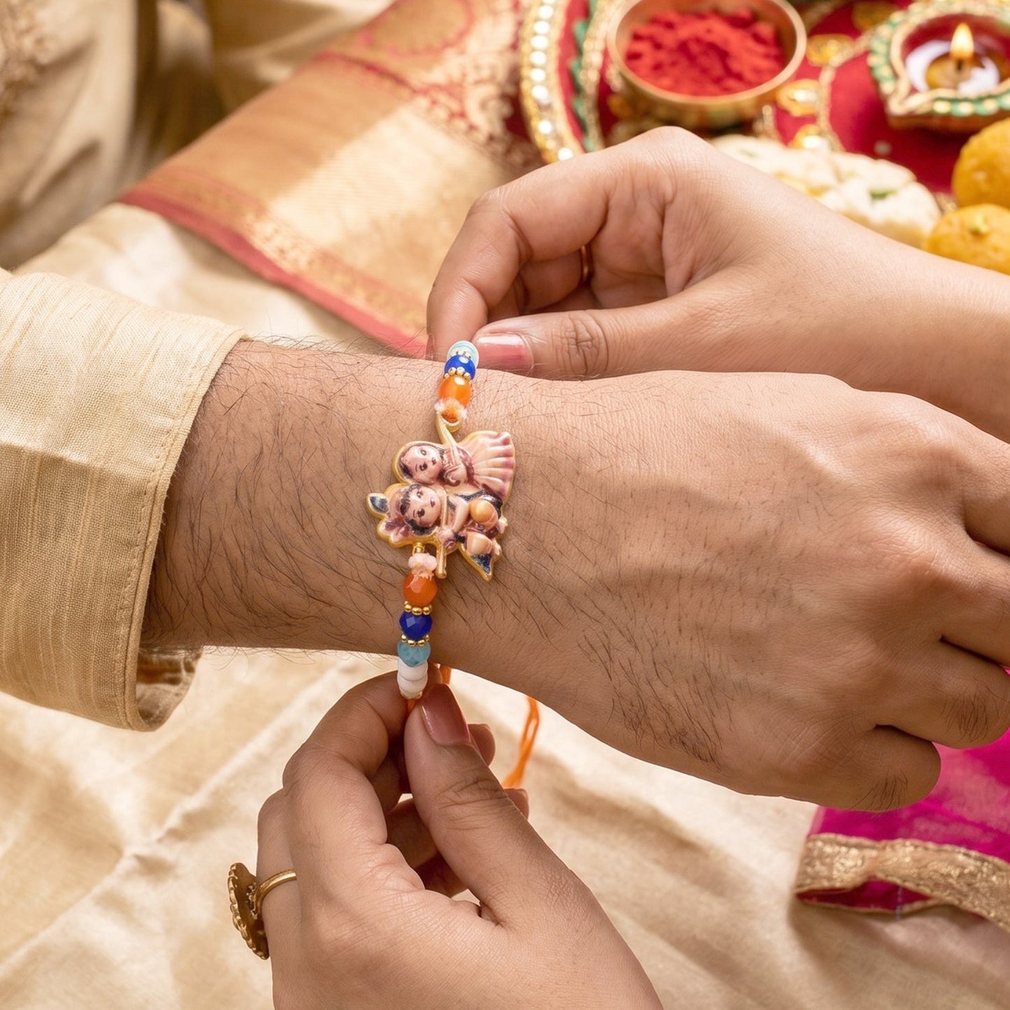 Traditional Radha Krishna Rakhi laid out ready for Raksha Bandhan rituals.