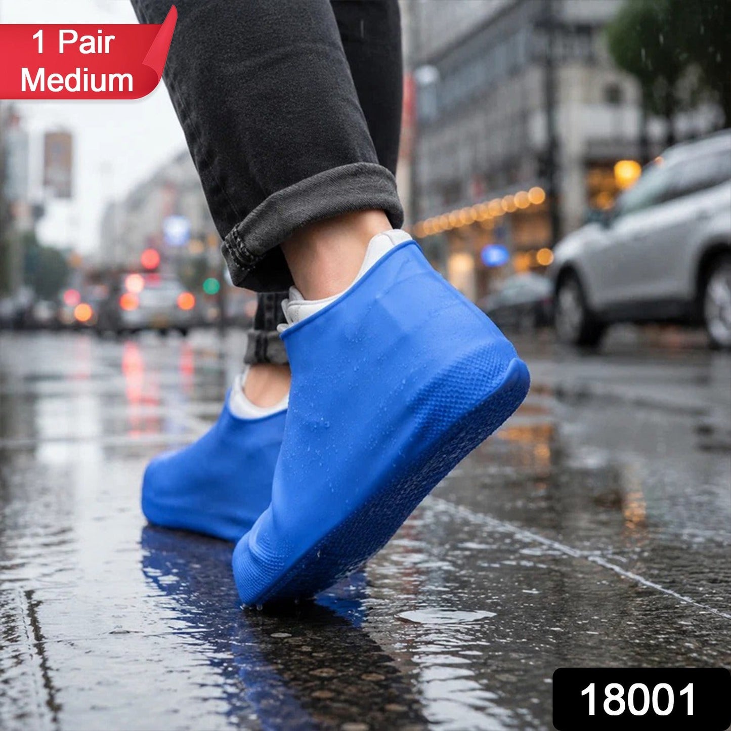 A person walks on a wet city street wearing blue silicone shoe covers over their shoes, with a red "1 Pair Medium" label.