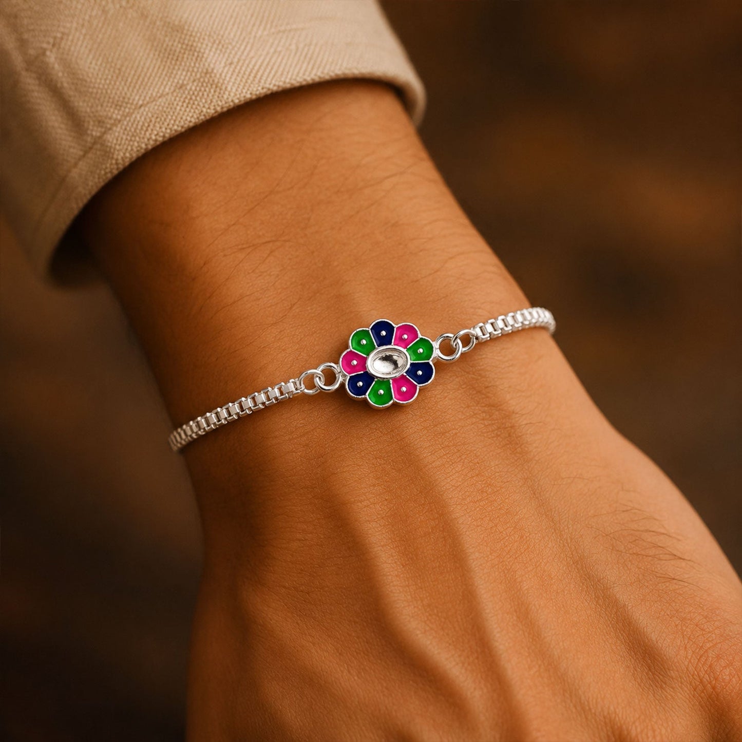 Flower design Rakhi tied elegantly on a brother's wrist for Raksha Bandhan celebration.