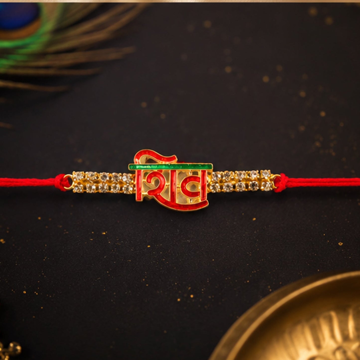 Close-up of Shiv letter rakhi with decorative beads and crystal detail