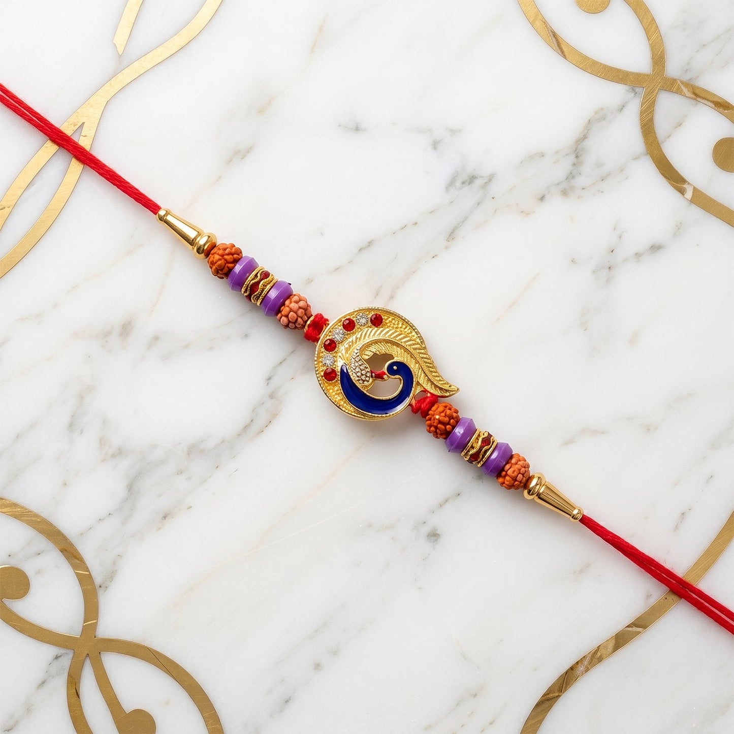 Collection of designer Rakhis, including the peacock design.