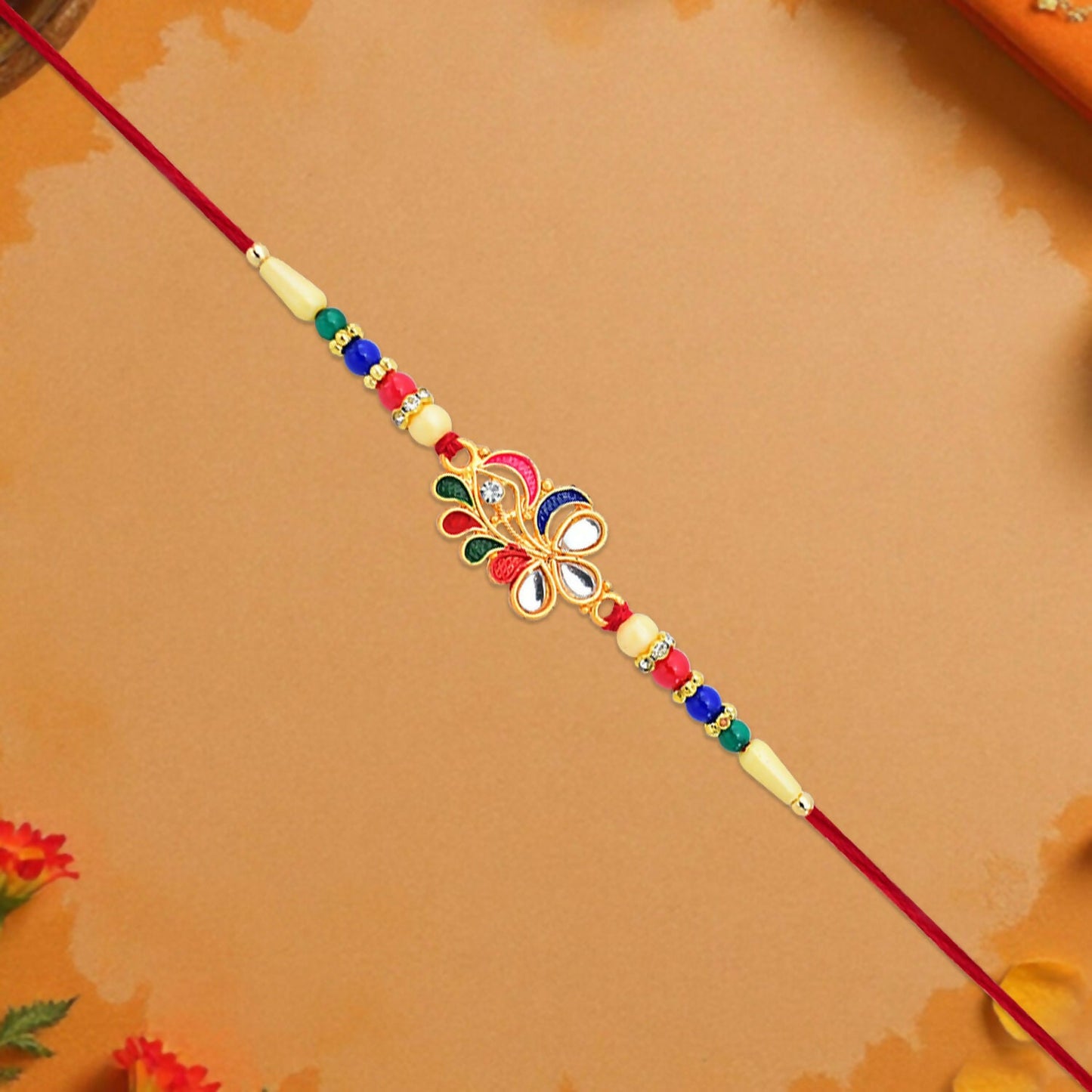 Front view showcasing the intricate handcrafted design of the Peacock Feather Rakhi.