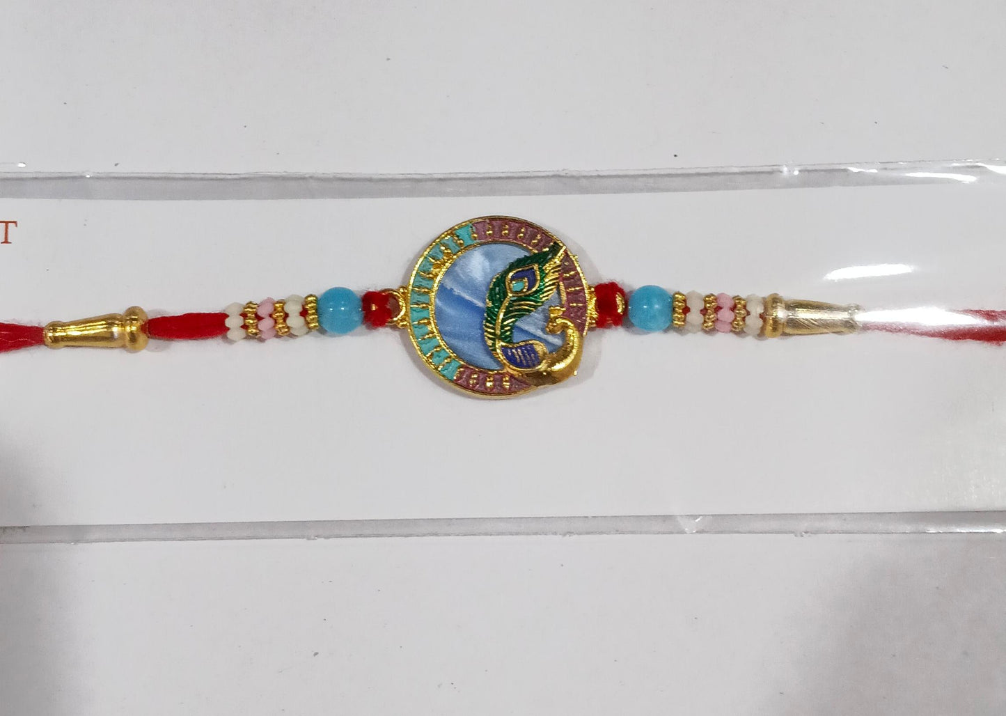 Peacock motif Rakhi with beads in vibrant colors