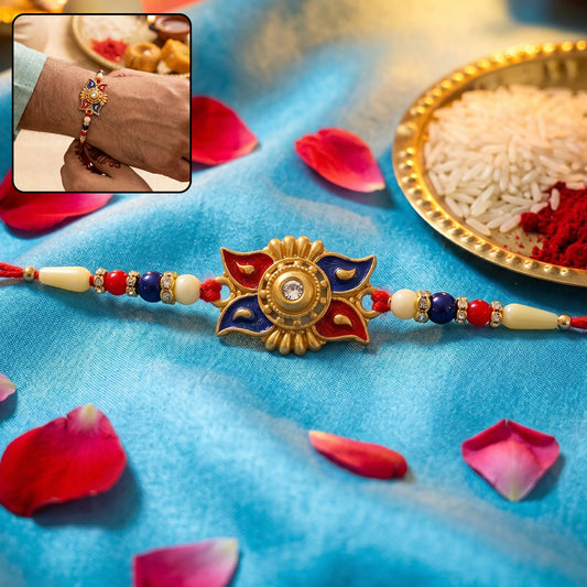 Elegant Gold Sunburst Rakhi featuring blue and red beads with delicate pearl accents.