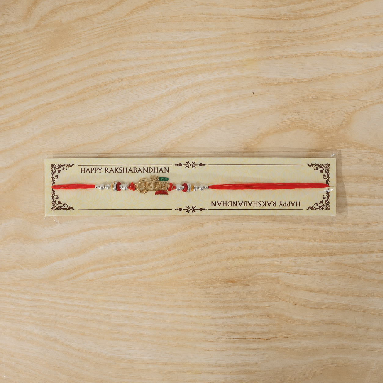 Folded Mahadev Damru Rakhi with beads and decorative elements