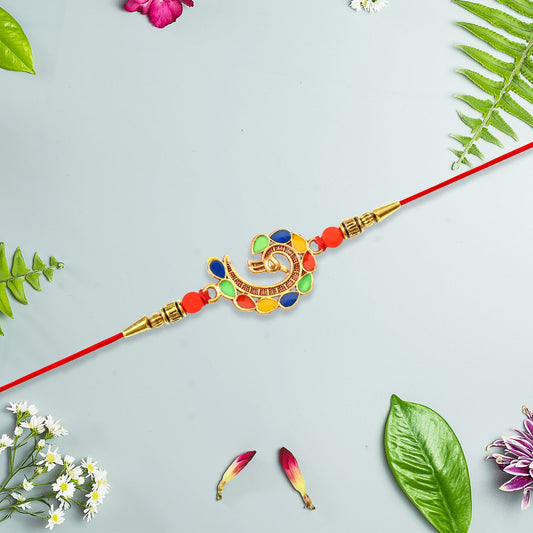 Close-up of an elegant peacock rakhi with vibrant colours and intricate design