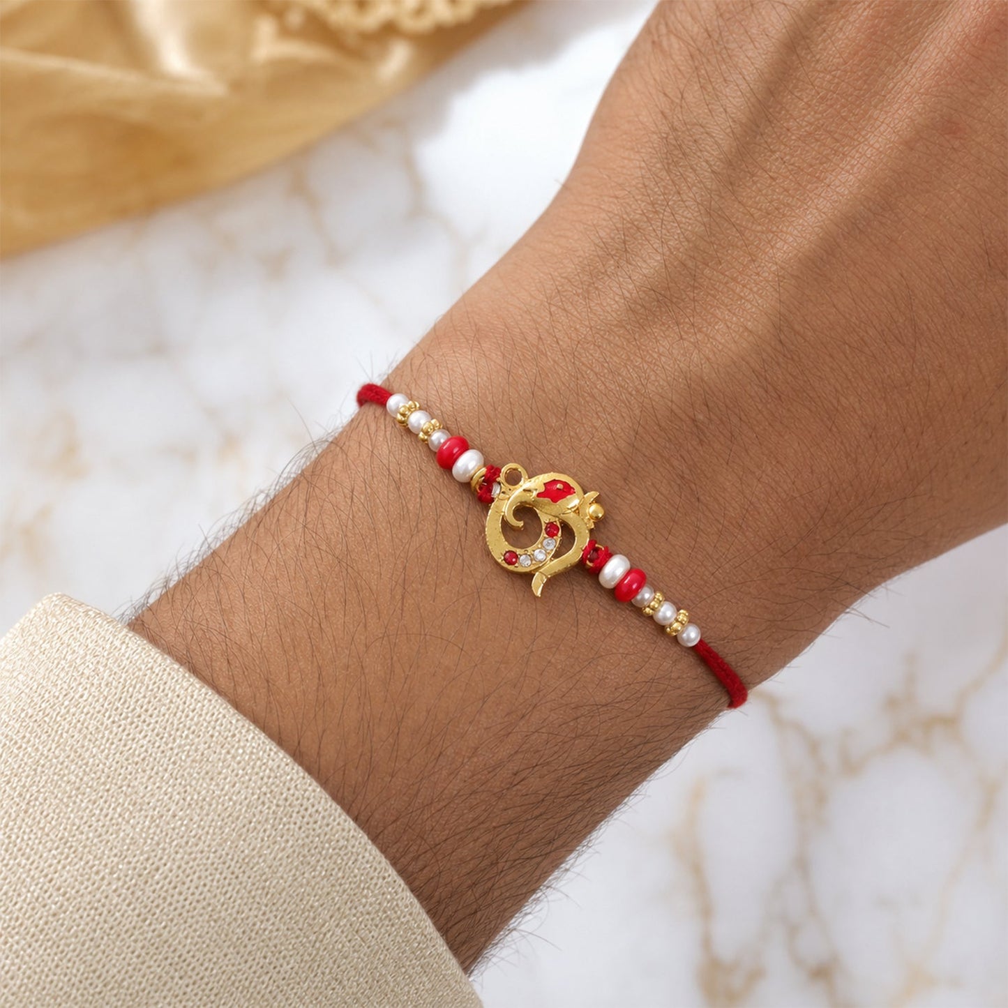 Stylish traditional Rakhi with attractive bead and pearl detailing