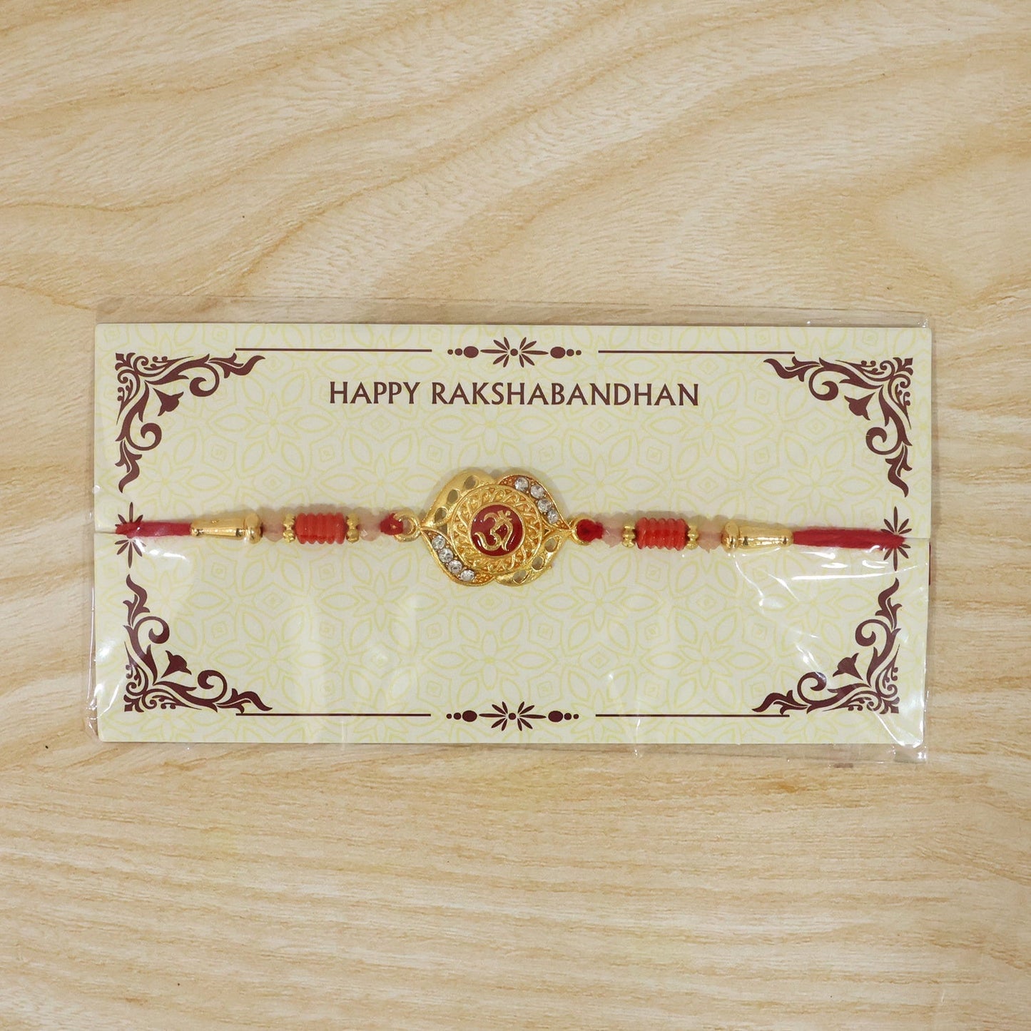 Full view of OM Antique Floral Designer Rakhi with thread.