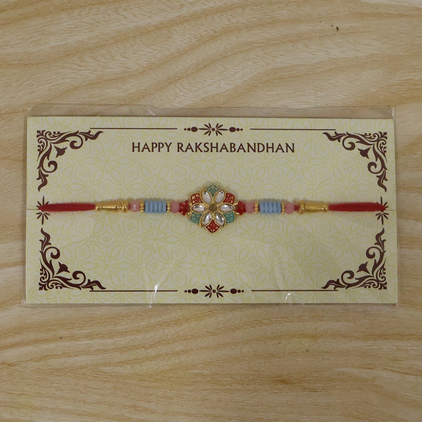 Festive floral kundan Rakhi with star petal motif