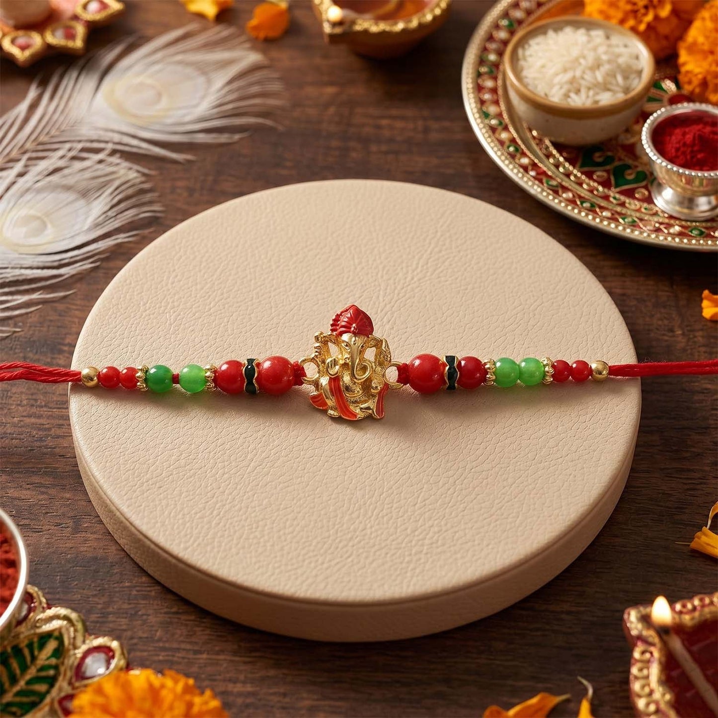 Traditional Ganesha motif on soft-thread Rakhi with beads