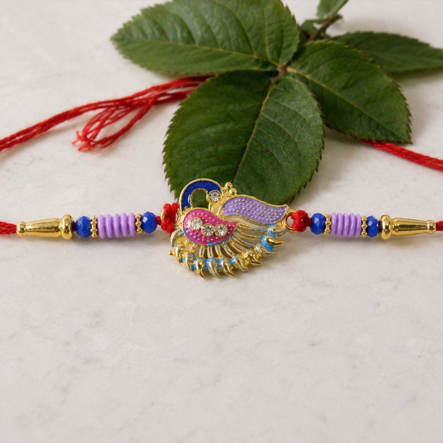 Designer Peacock Rakhi with beads and thread