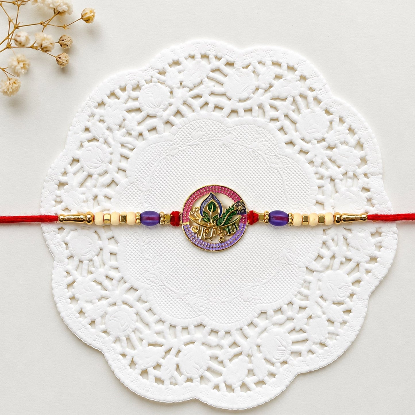Colorful Radha Krishna Rakhi with decorative beads and traditional design