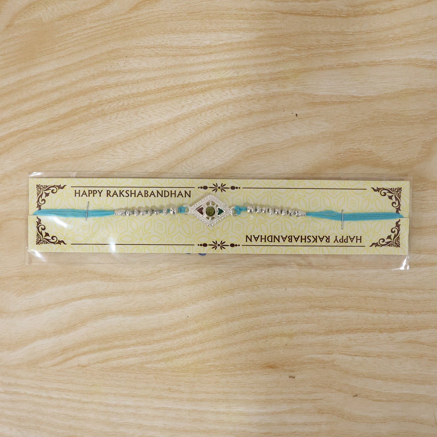 Full view of Silver Diamond Kundan Rakhi with thread