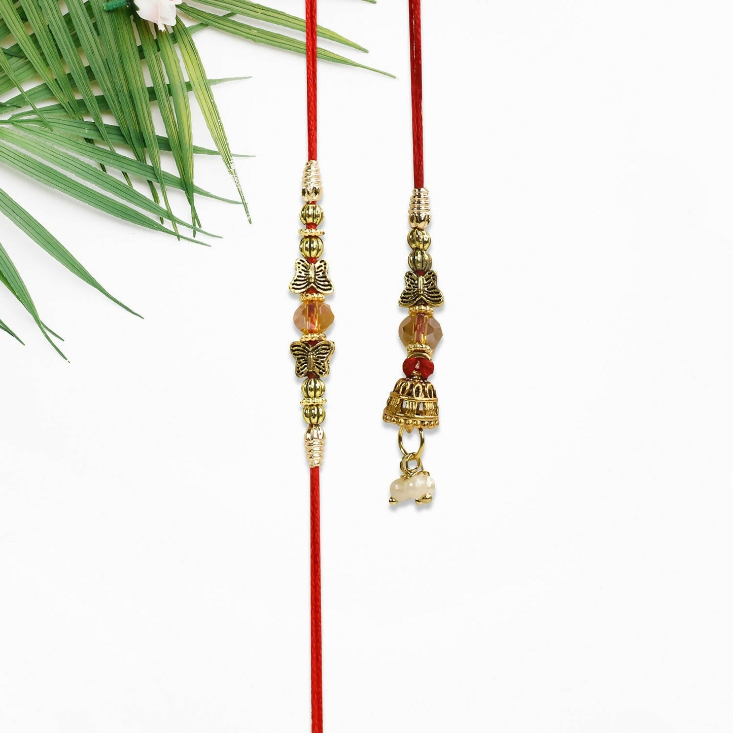 Random design Bhaiya Bhabhi Rakhi pair showcasing intricate traditional patterns with festive colors