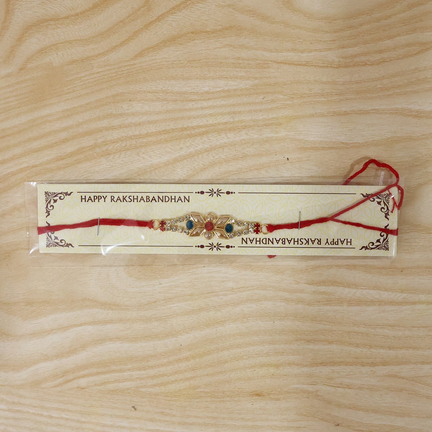 Full view of Pastel Floral Kundan Rakhi on white background
