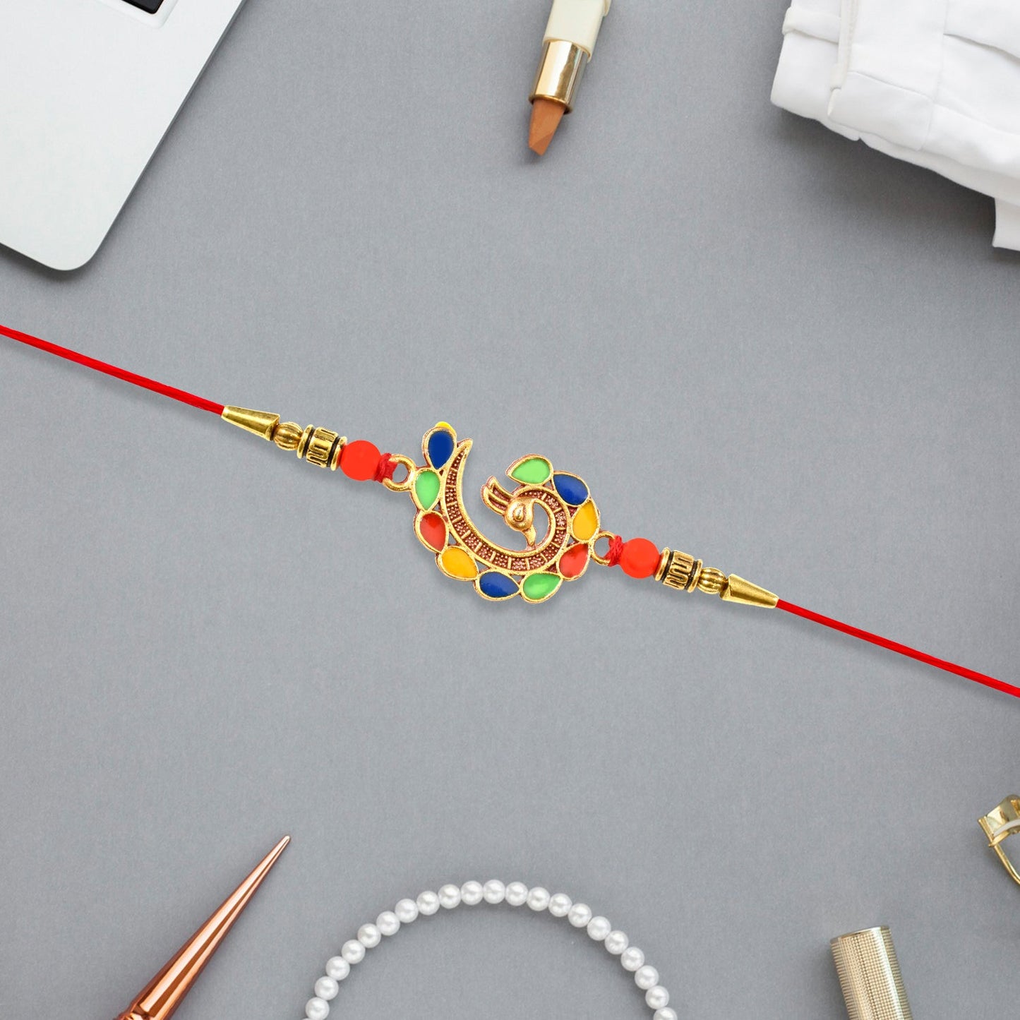Peacock rakhi showcasing detailed craftsmanship and comfortable thread